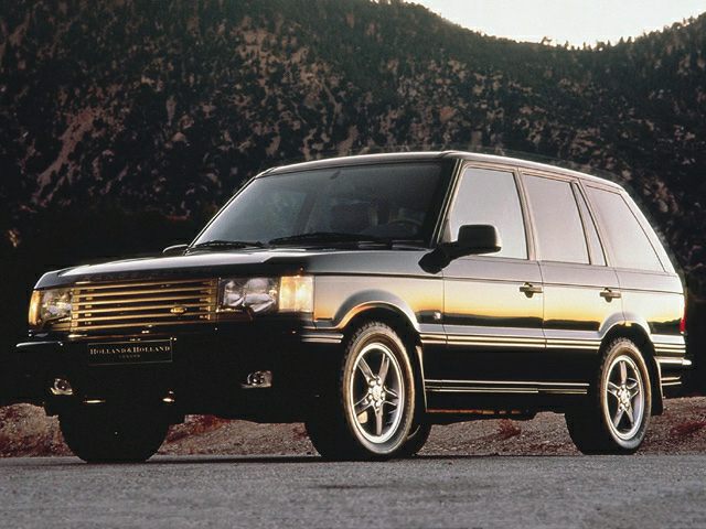 Boxy mid-90s SUV with bold grille and alloy wheels