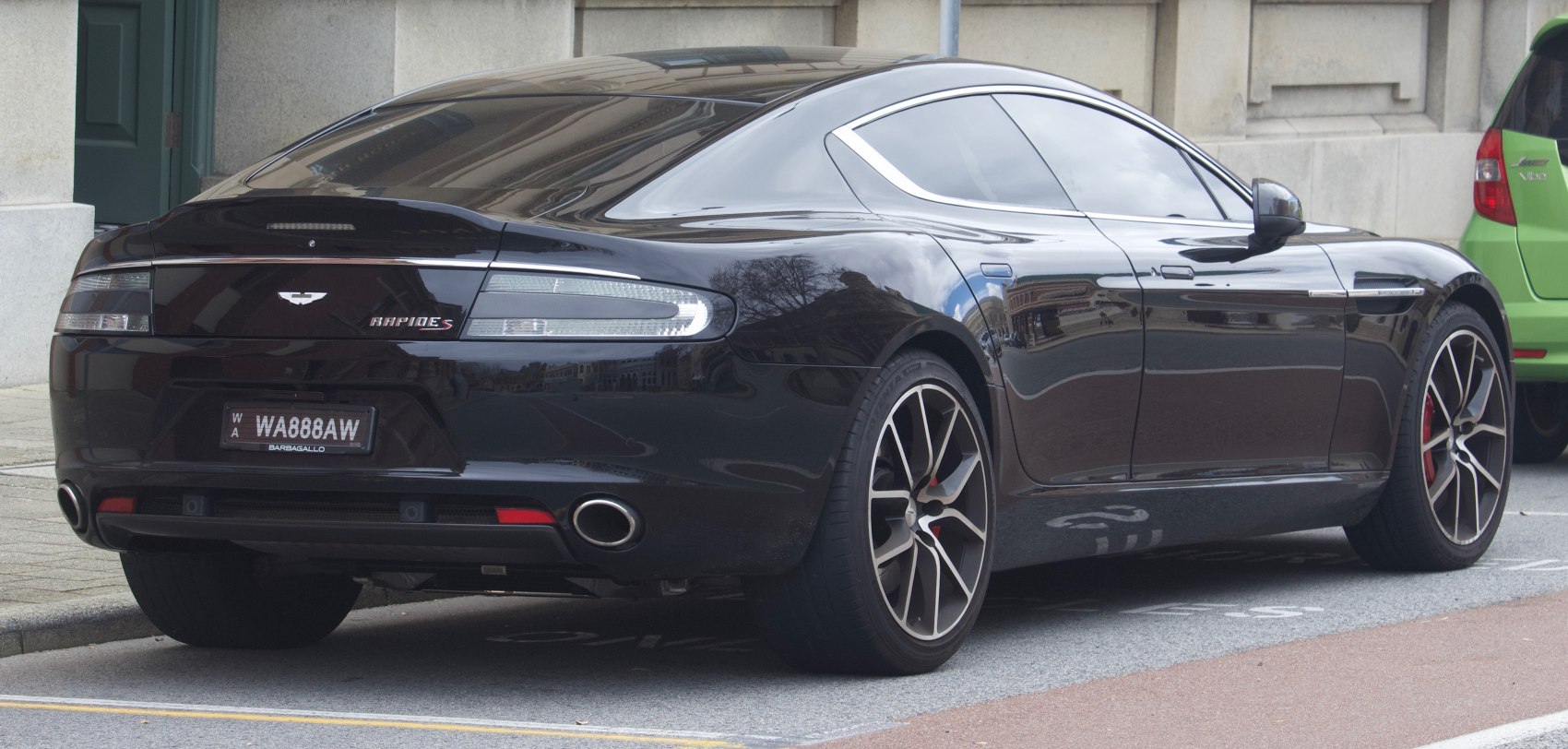 Rear side view, tail lights, alloy wheels, exhaust pipes