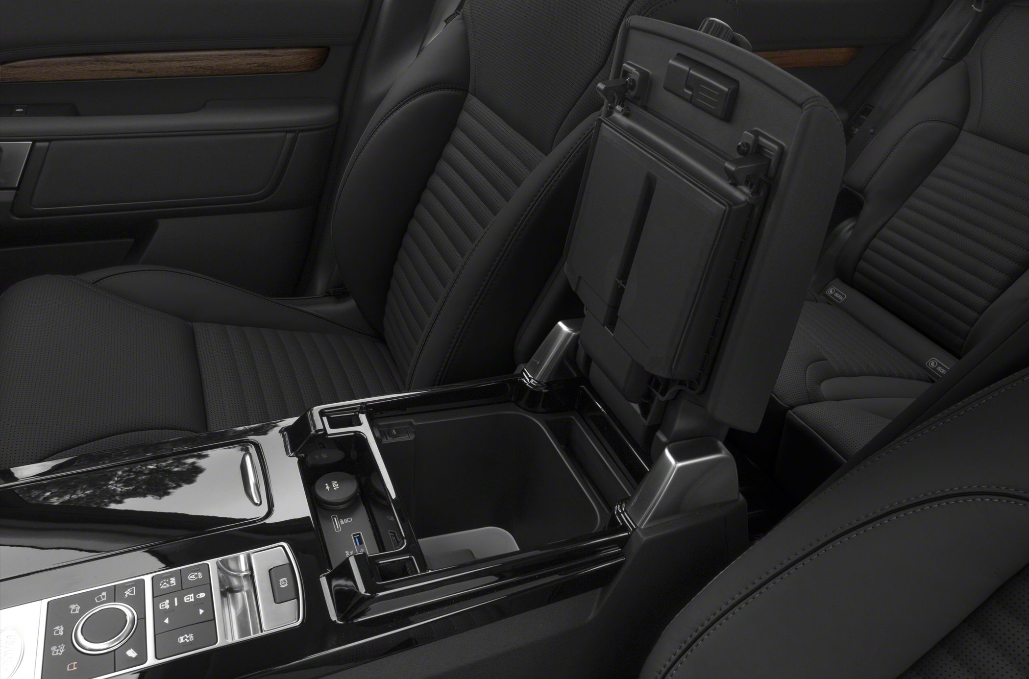 Center console with storage, control buttons, and USB ports in luxury SUV interior