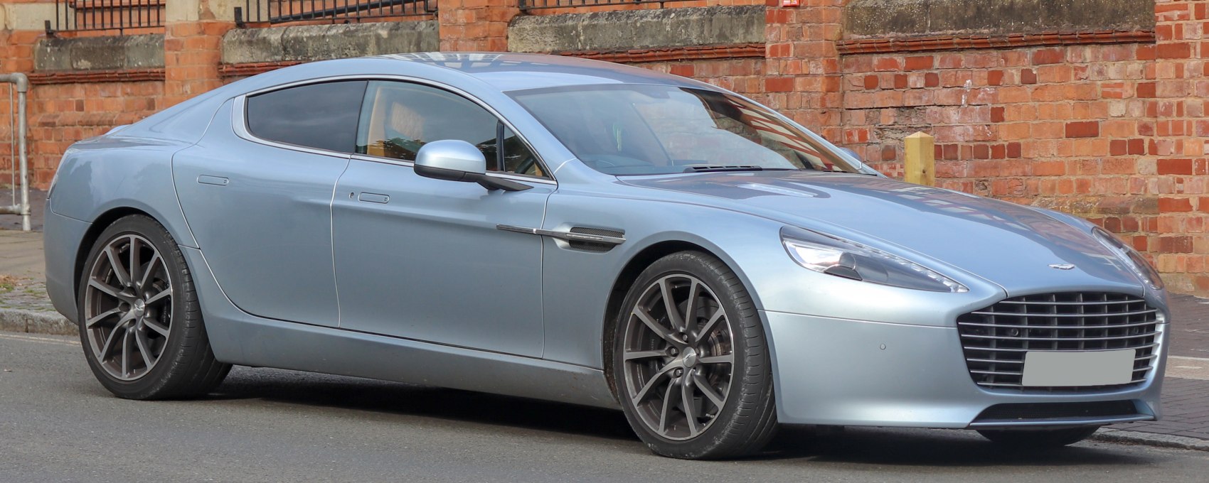 Luxury four-door coupe with wide grille and sporty wheels