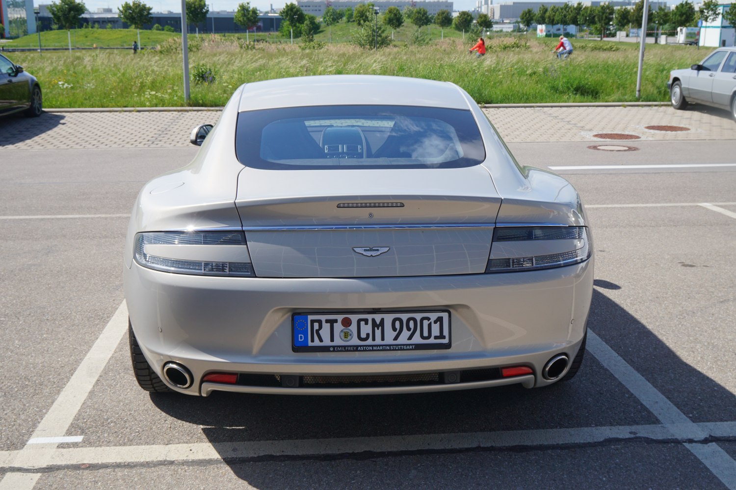 Rear view showing sleek tail lights and dual exhaust pipes