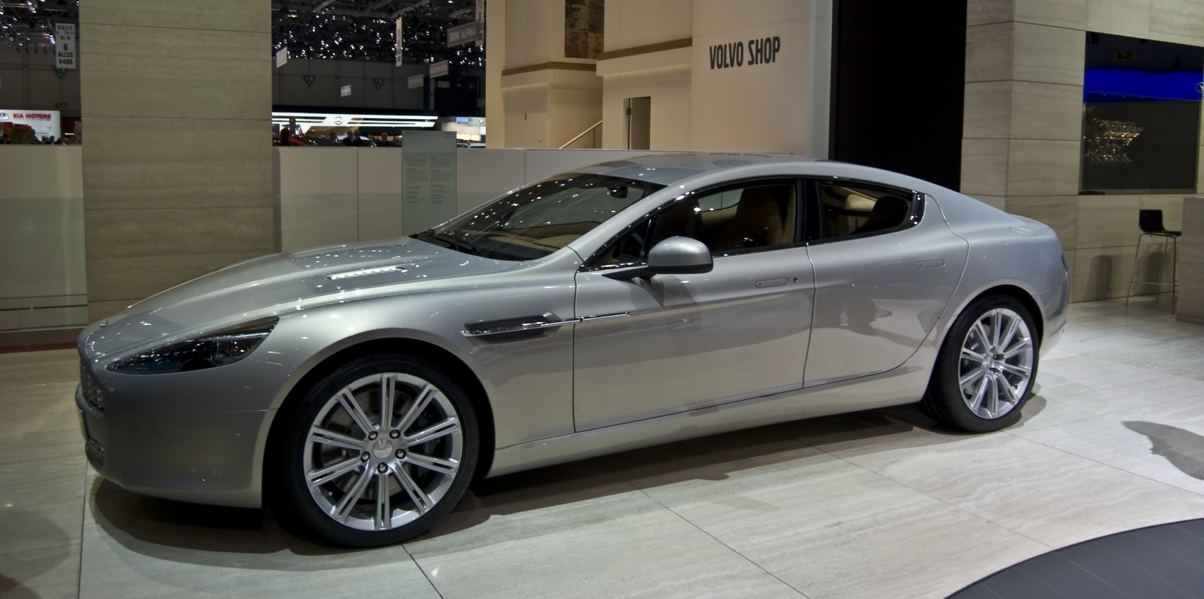Four-door luxury sedan with sleek aerodynamic shape and alloy wheels
