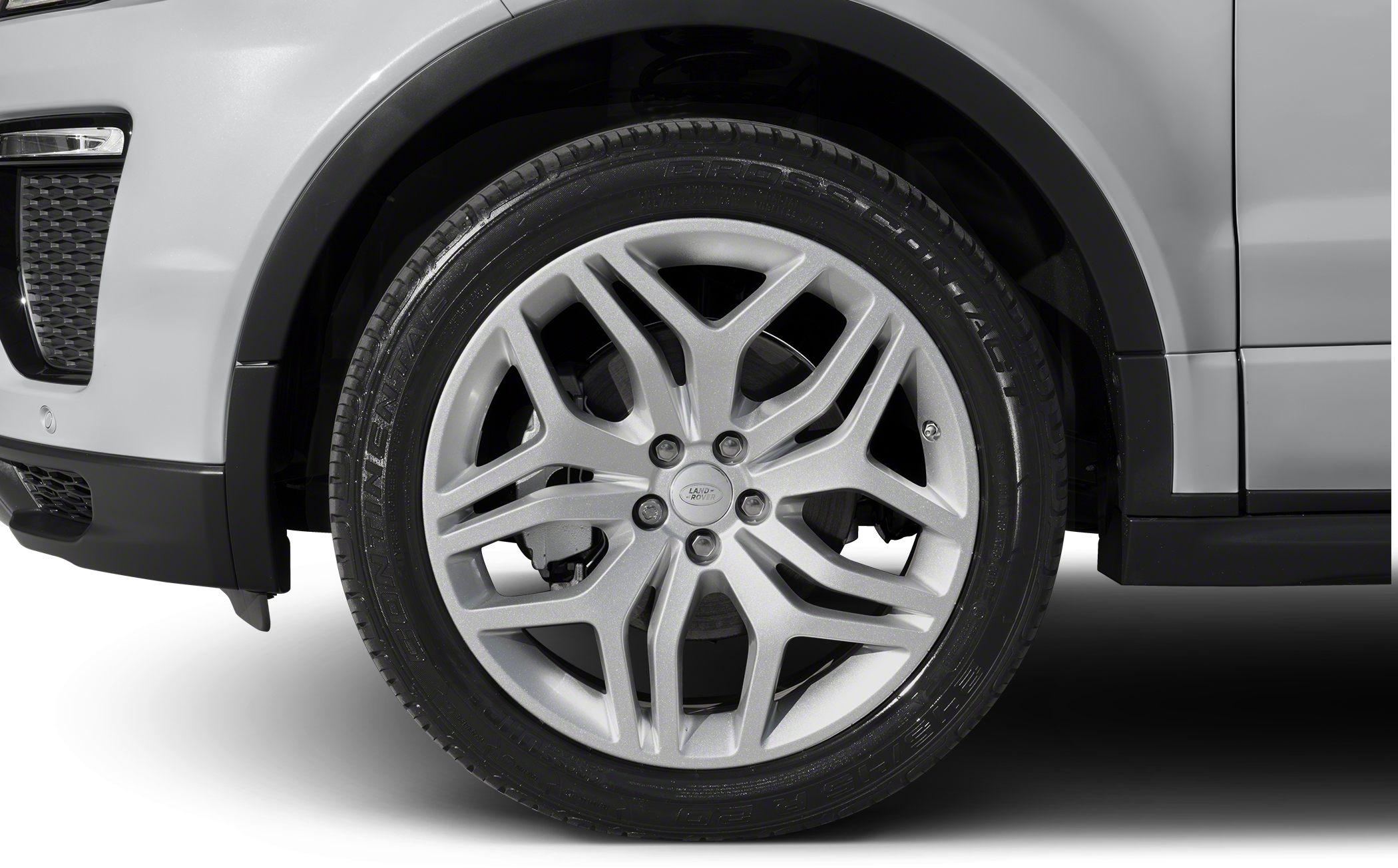 Multi-spoke silver alloy wheel and tire close-up.