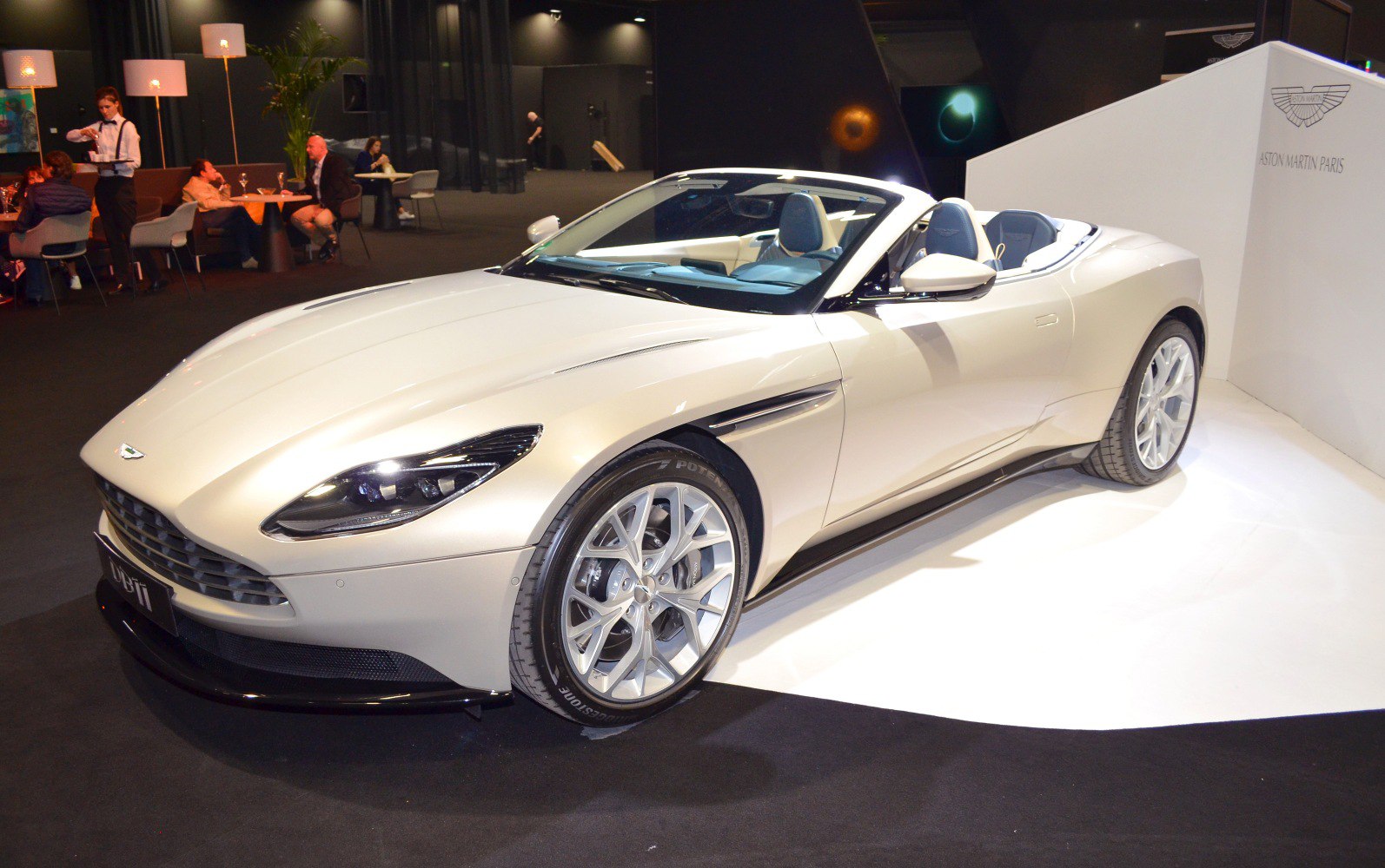 Convertible luxury sports car with sleek front and side profile.