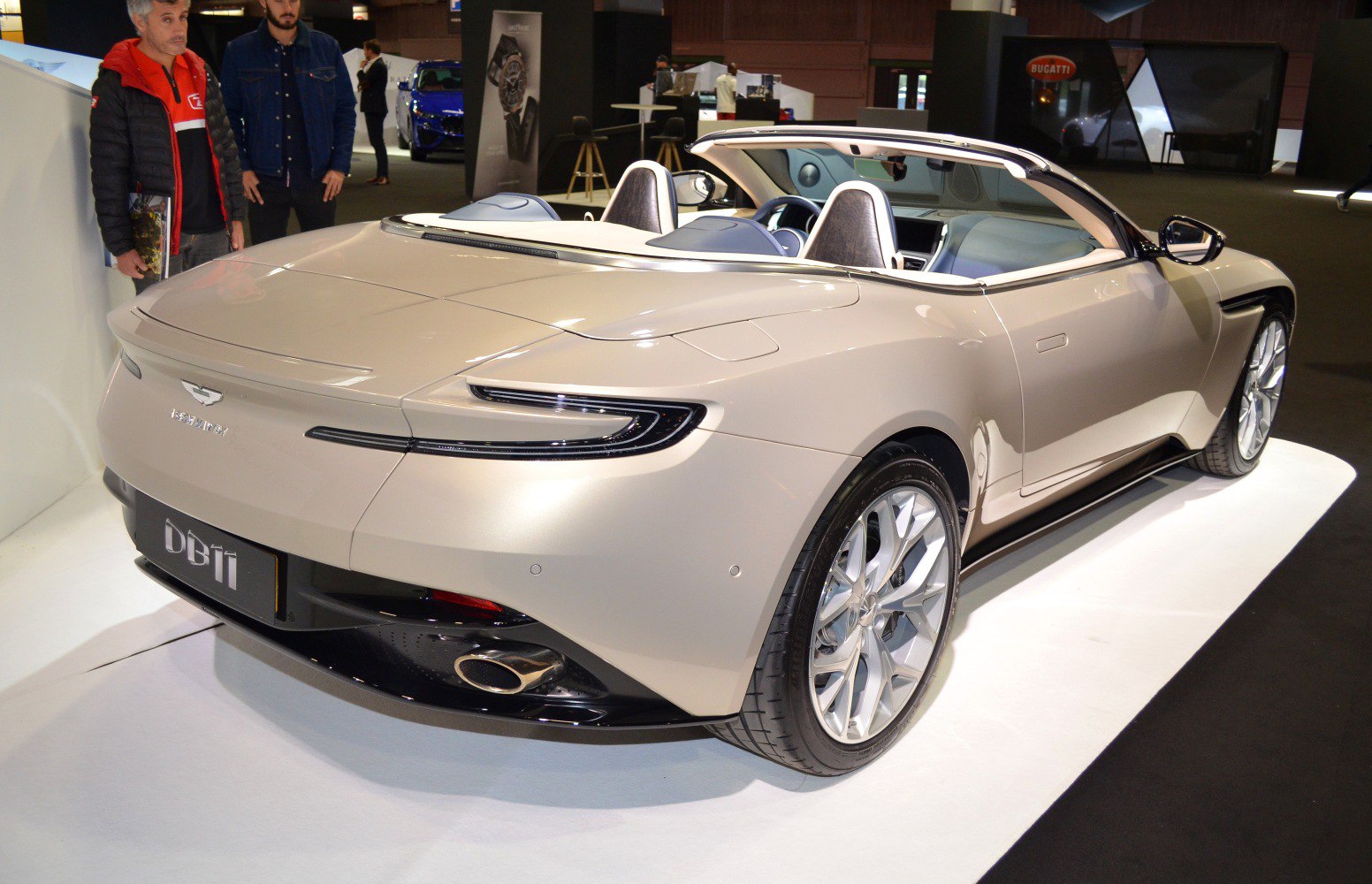 Rear view of a convertible with modern taillights and dual exhaust