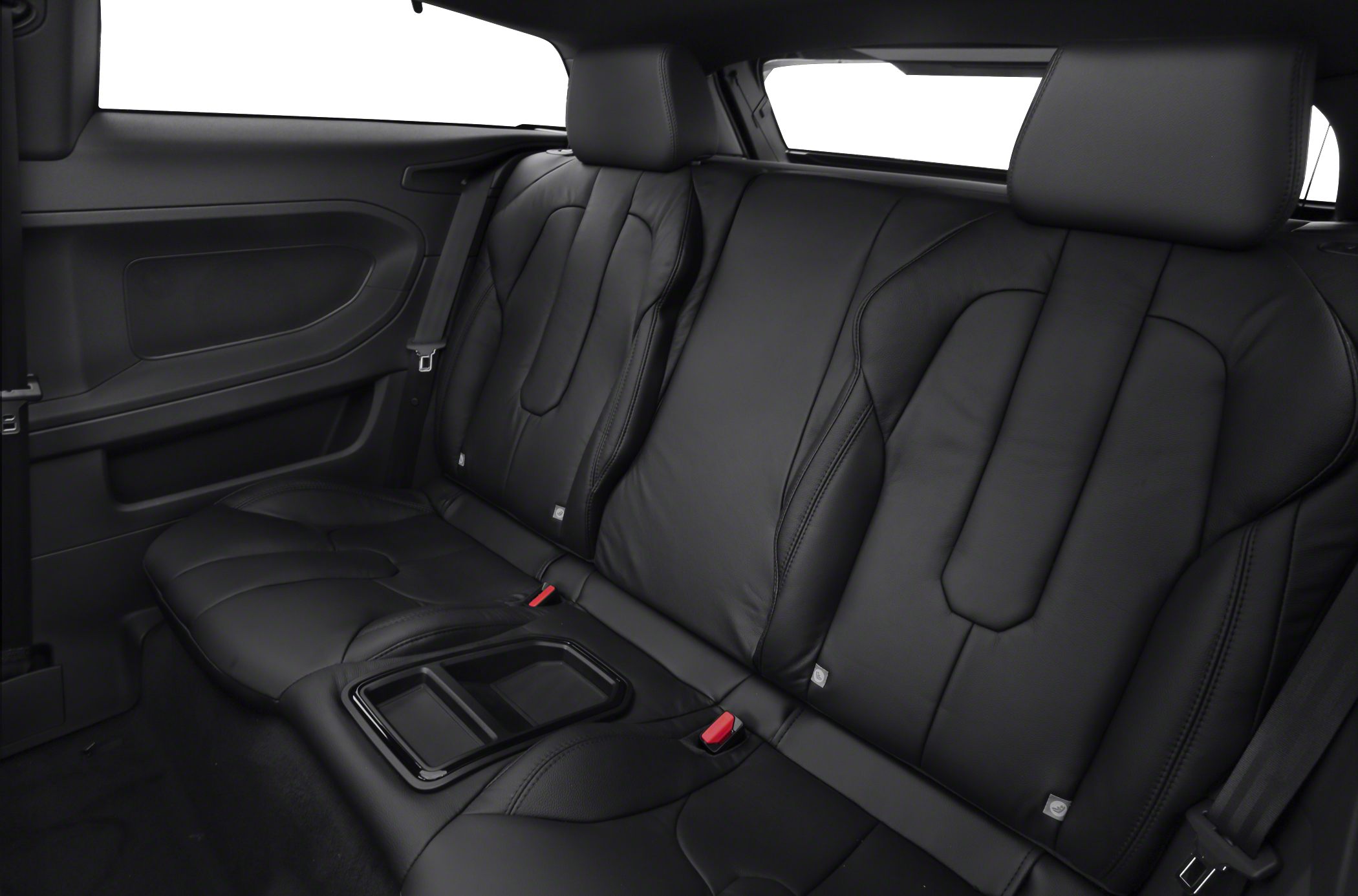 Leather rear seats with integrated armrest in a coupe interior
