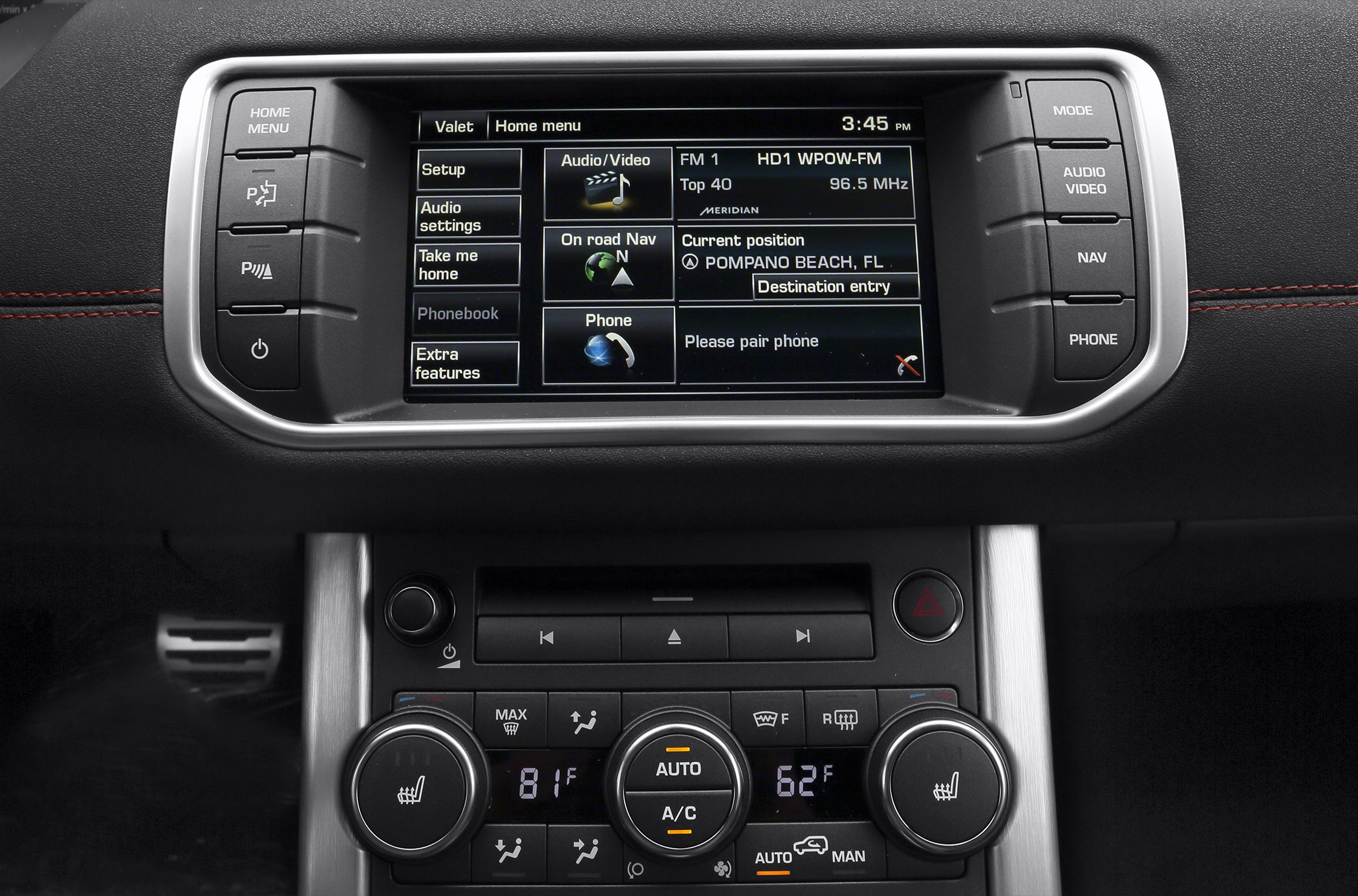 Car infotainment screen with navigation and dual-zone climate control.