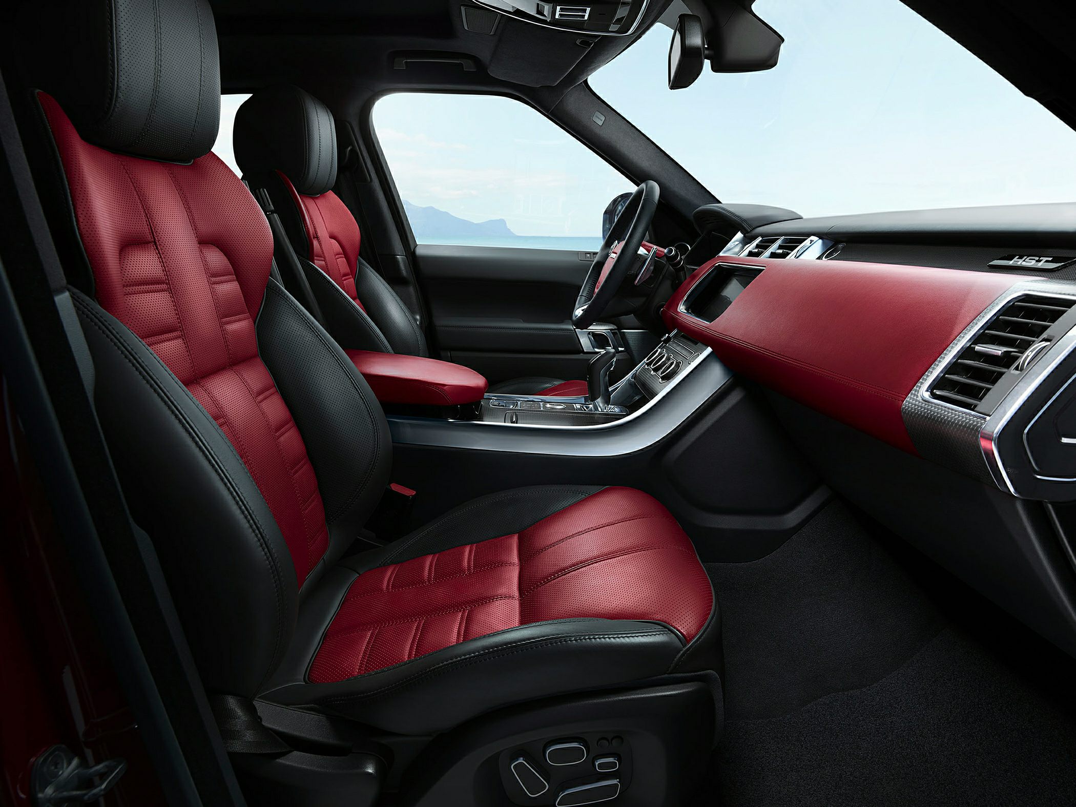Red and black luxury leather seats and dashboard interior.