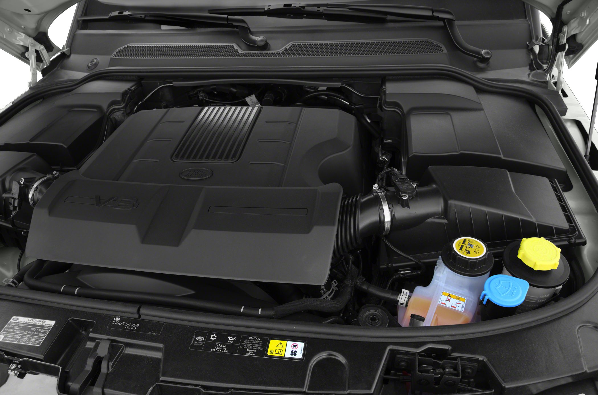 V8 engine bay with fluid reservoirs and engine cover