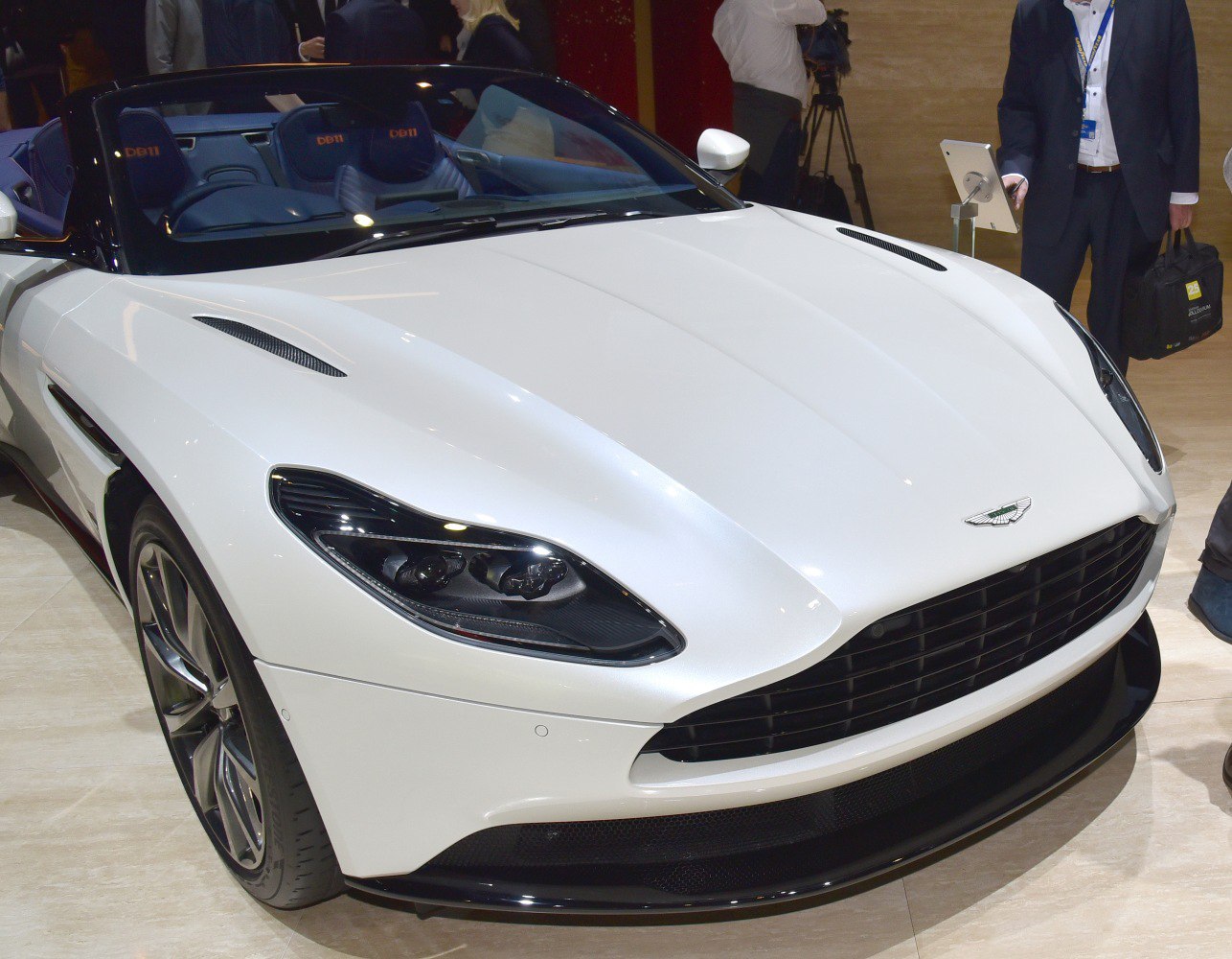 Luxury convertible with distinctive headlights and ventilated hood.