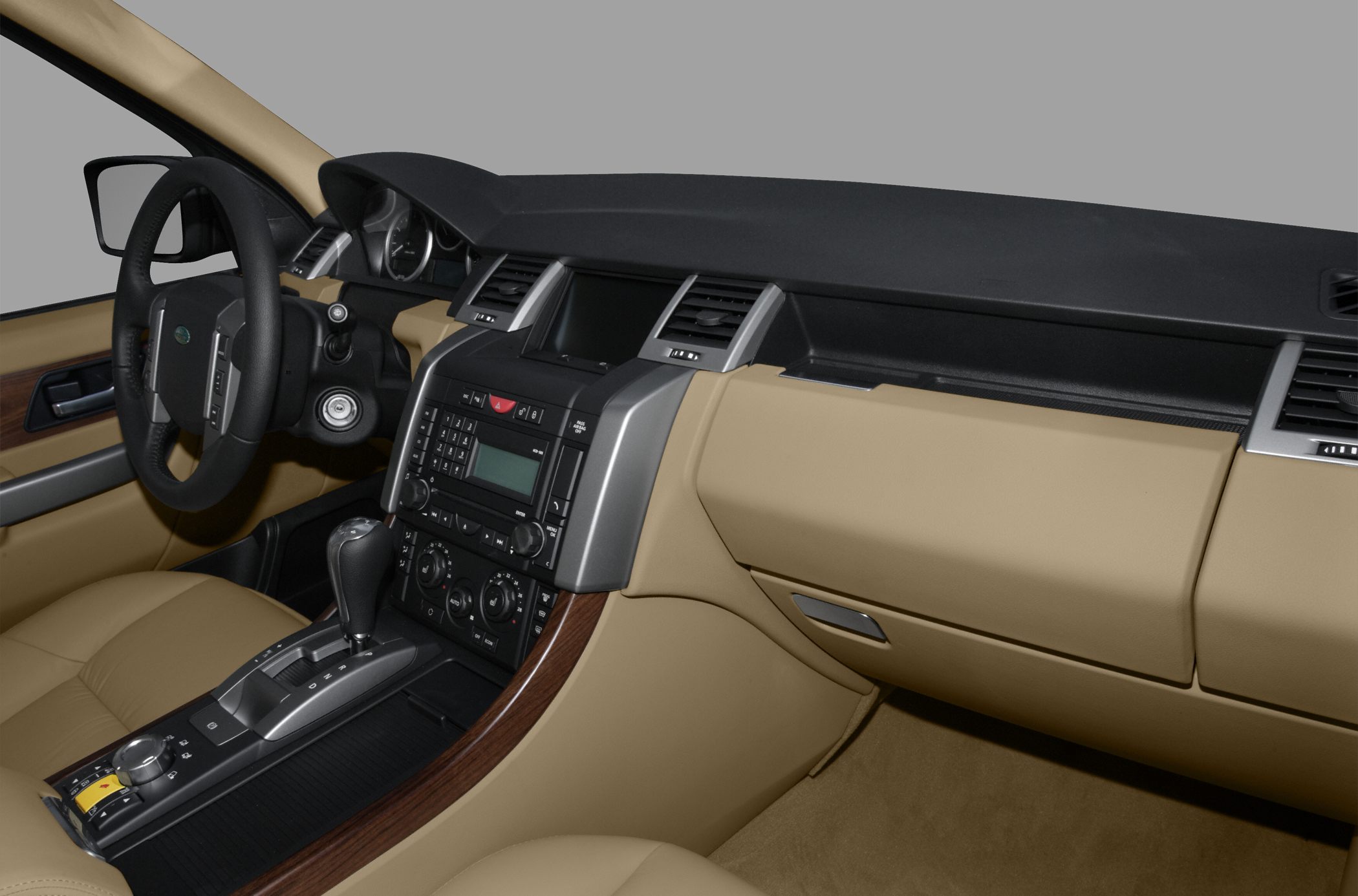 Beige leather interior with dashboard, center console, and automatic gear shift