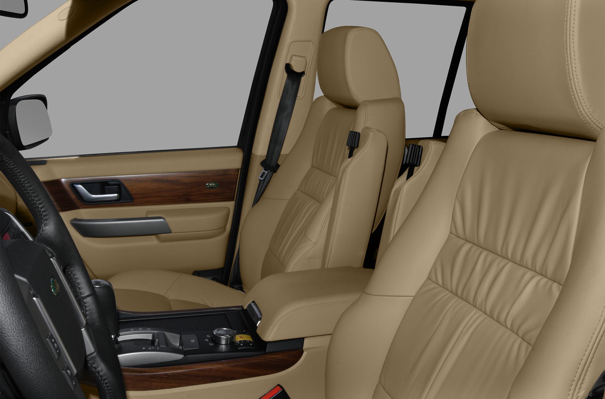 Beige leather seats with wood trim and center console controls