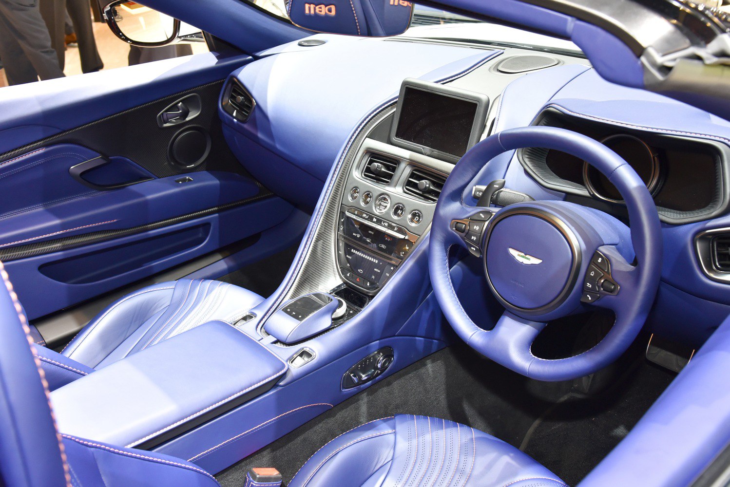 Luxury blue leather interior with modern dashboard and steering wheel