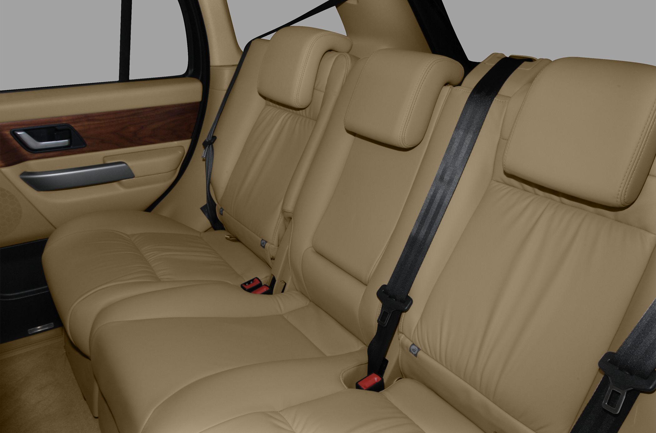 Beige leather rear seats with headrests and seat belts