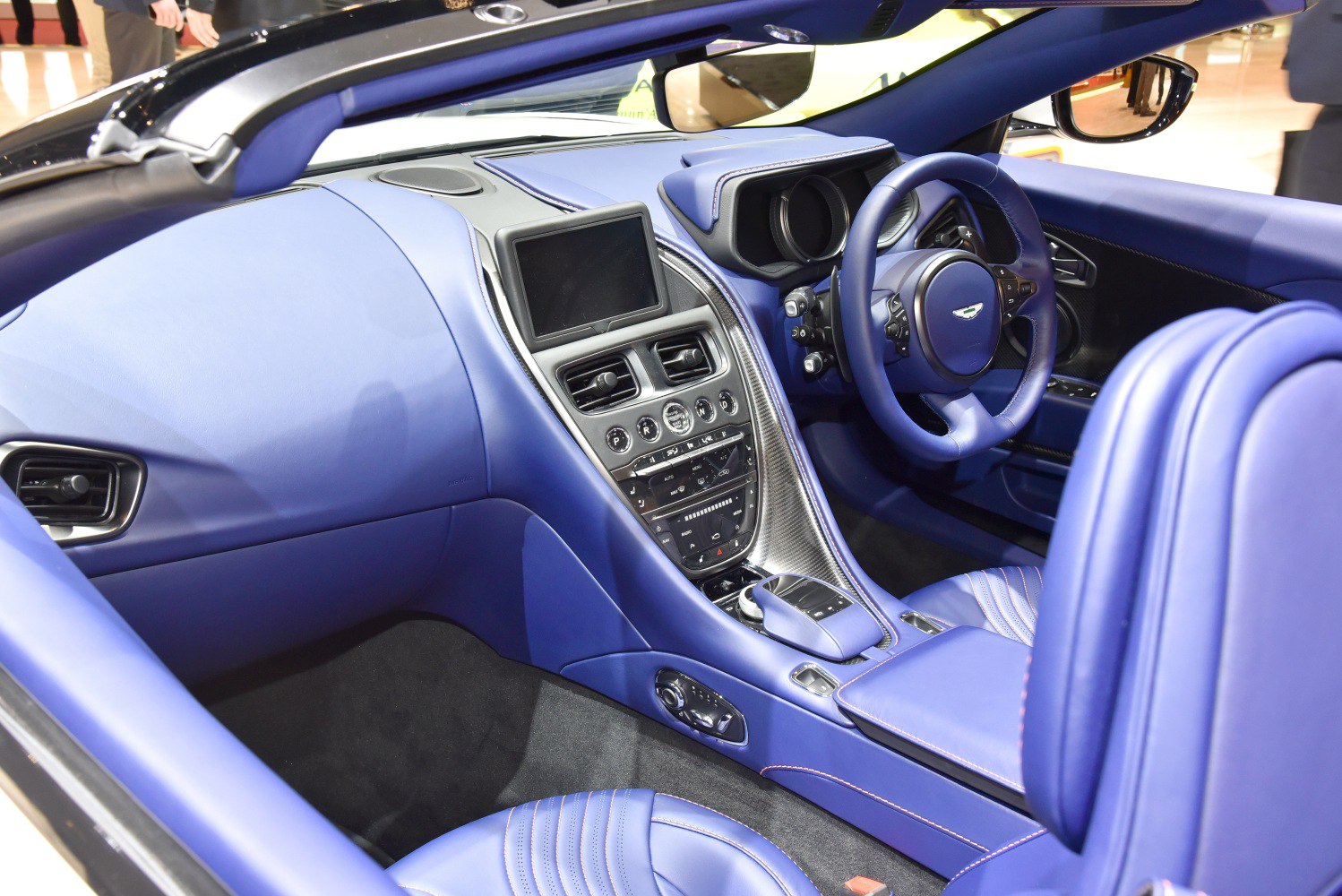Blue leather convertible interior with central console and advanced controls