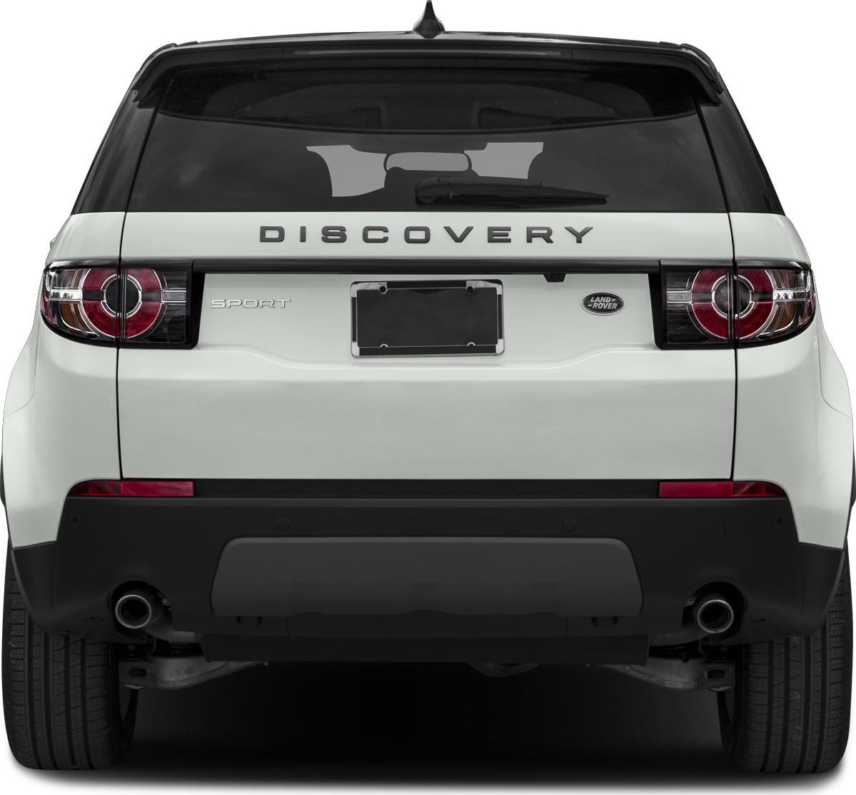Rear view of SUV with circular tail lights and dual exhaust pipes