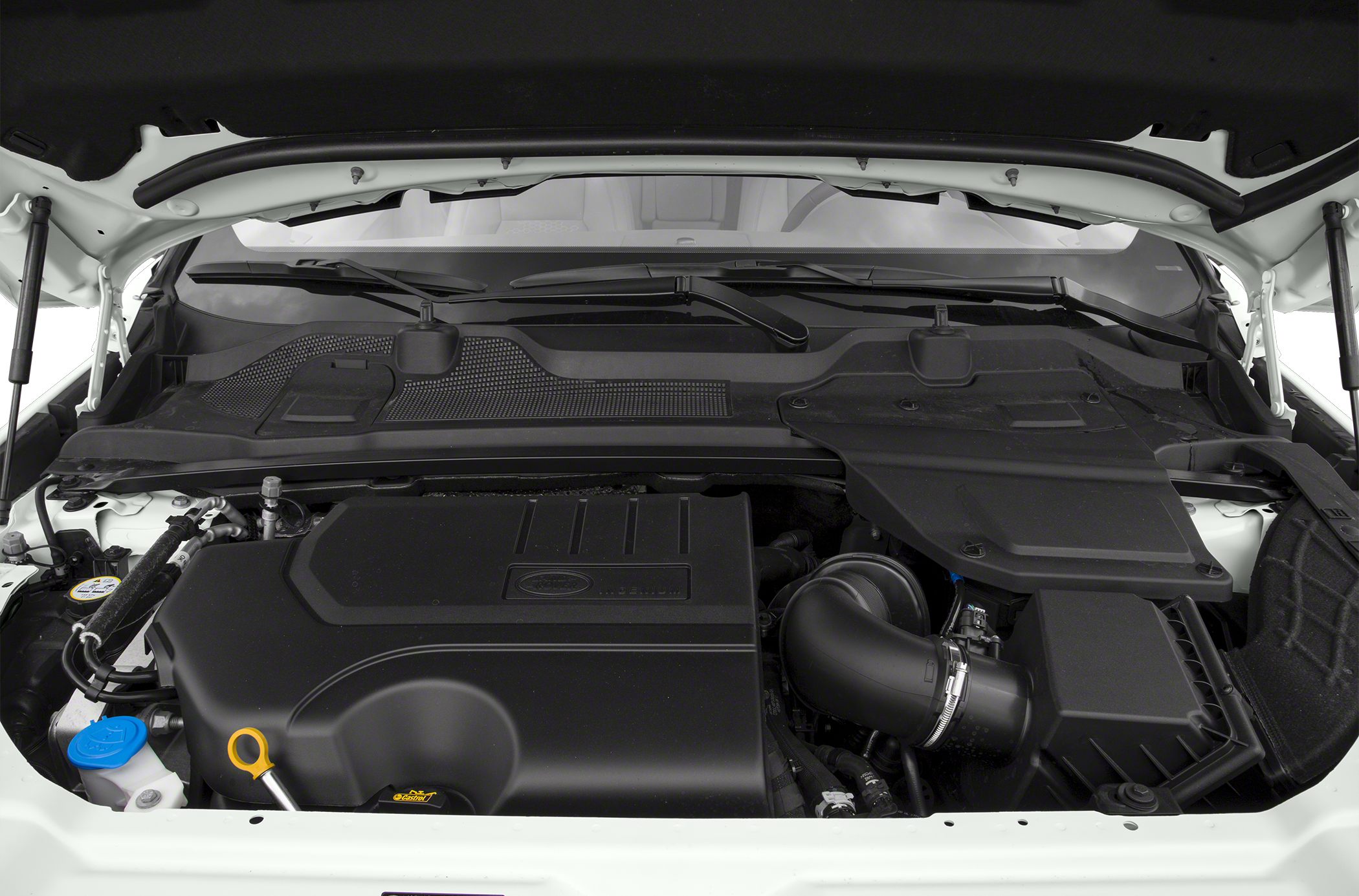 Engine bay with covered engine, air intake, and fluid reservoirs