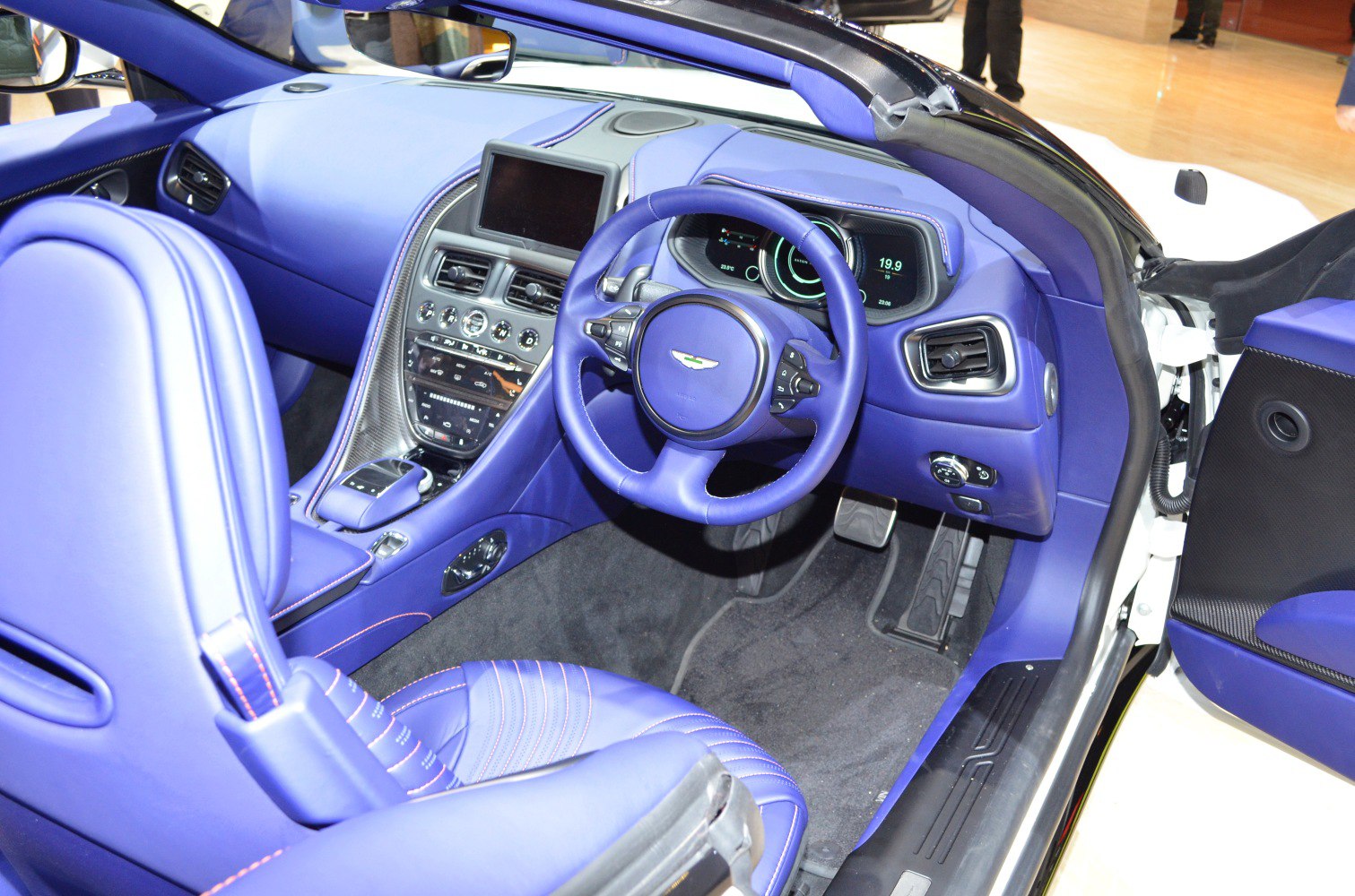 Luxury convertible interior with digital dashboard and sporty steering wheel