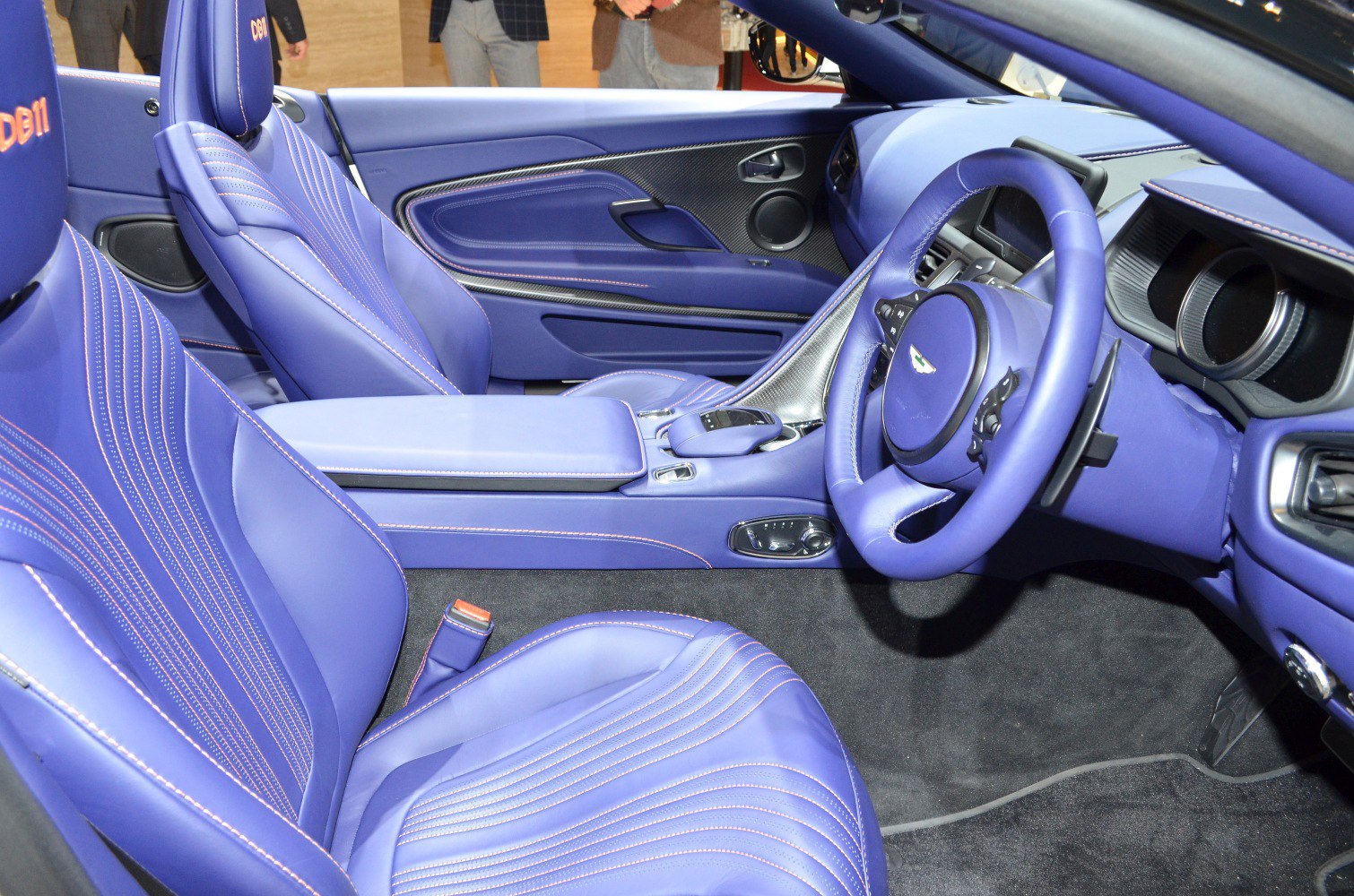 Blue leather interior with detailed stitching and carbon fiber trim