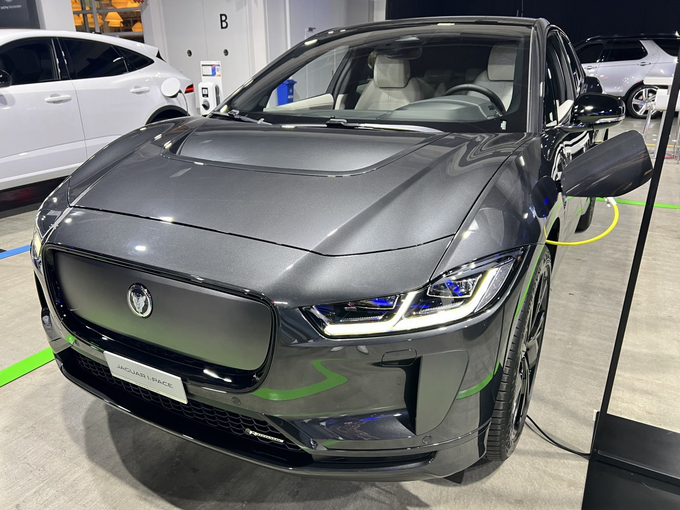 Sleek front view with closed grille and LED headlights