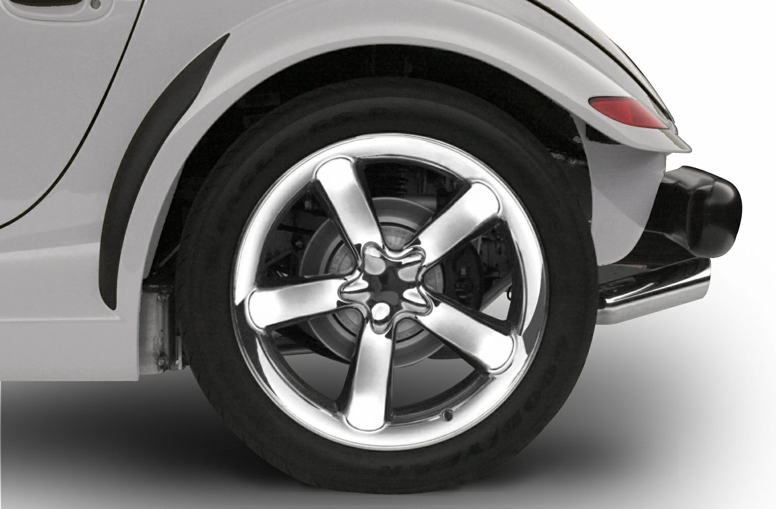 Close-up of a polished 5-spoke rear wheel and fender with visible exhaust tip