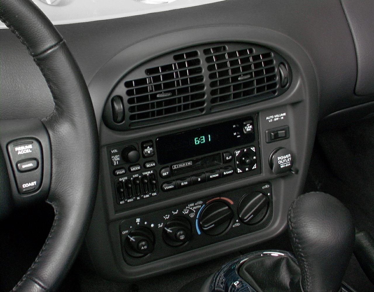 Dashboard with air vents, radio controls, and climate control knobs