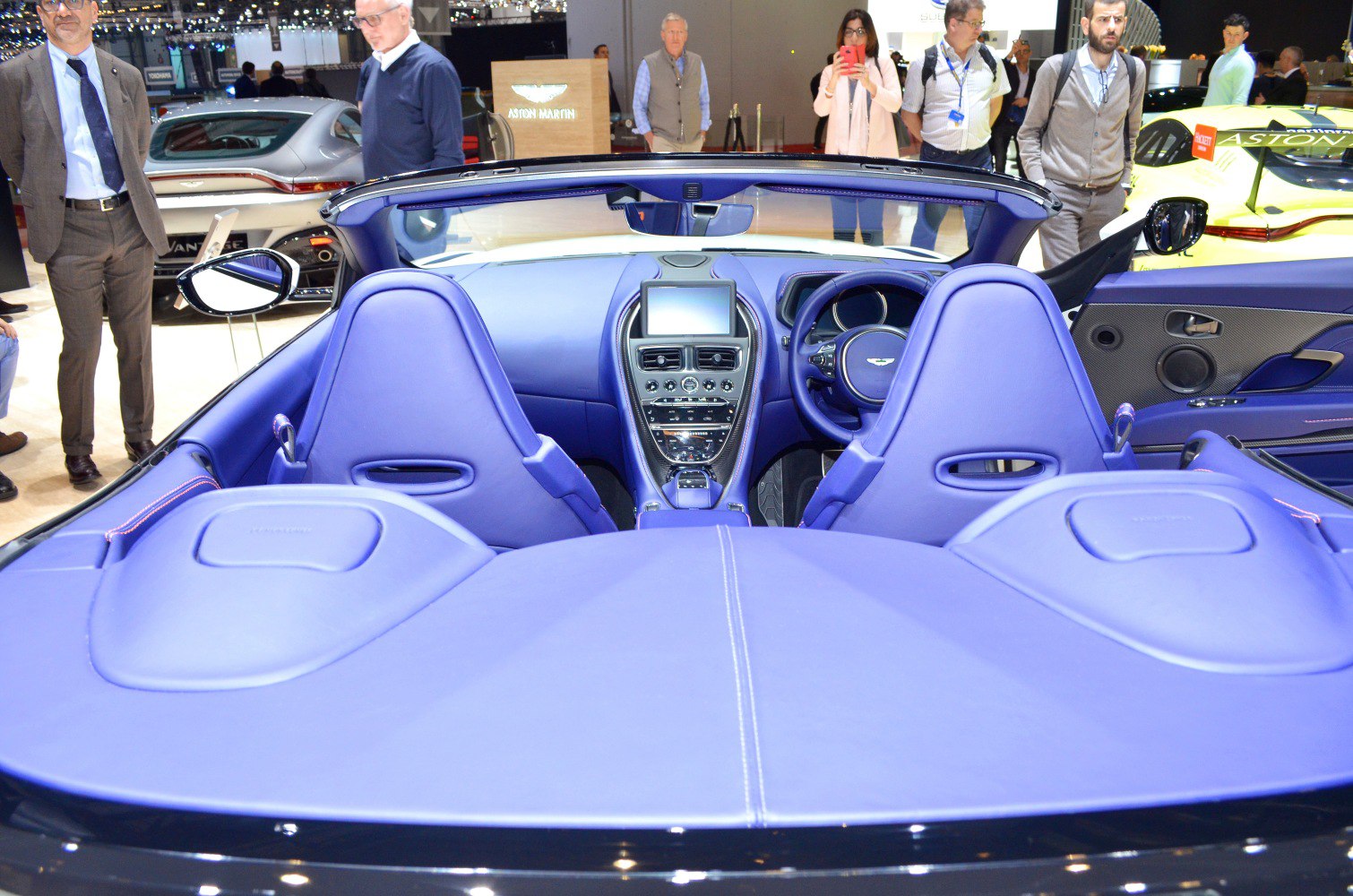 Convertible interior with blue leather upholstery and detailed center console