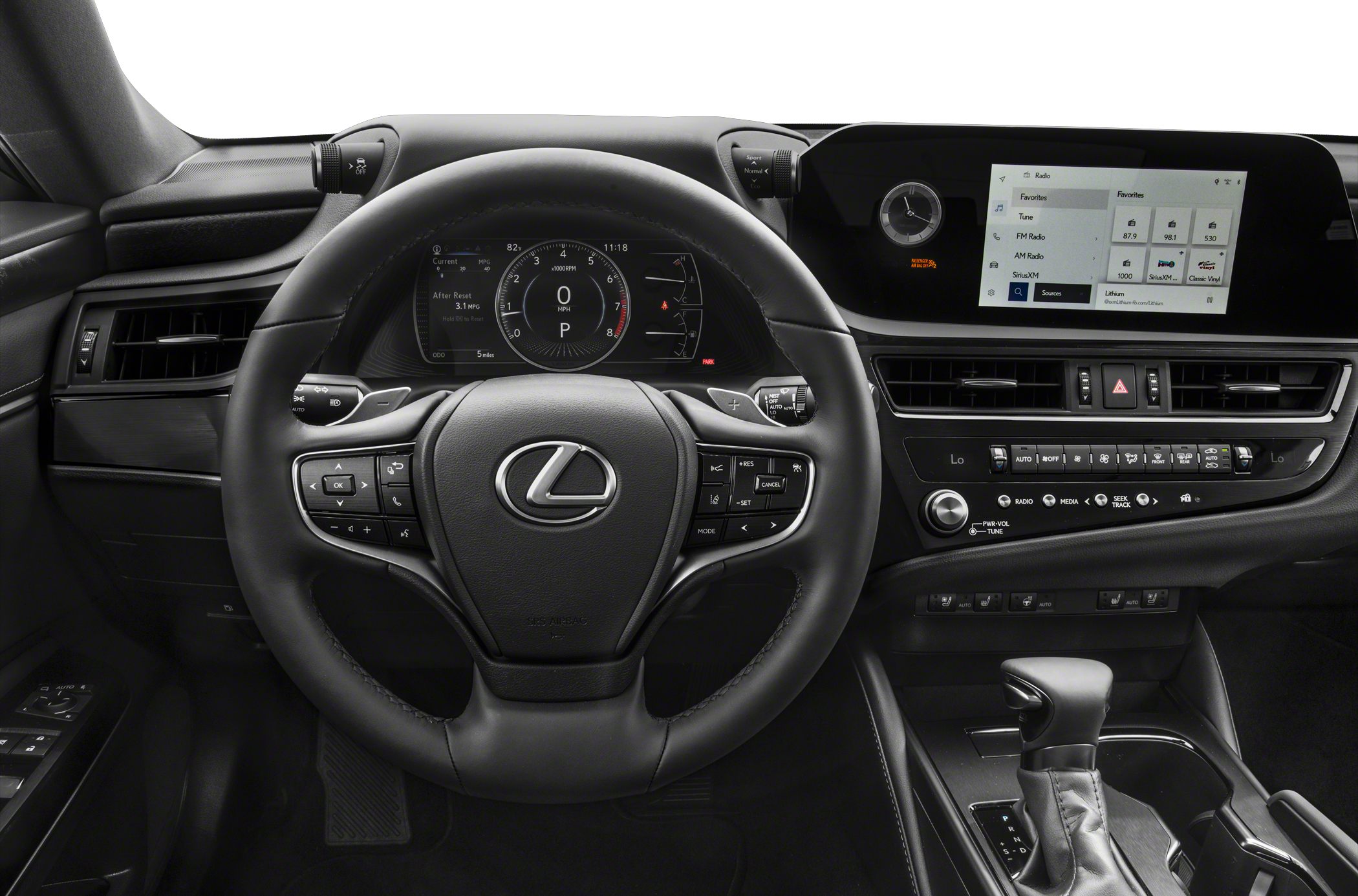Interior focus on steering wheel, digital dashboard, and infotainment system.
