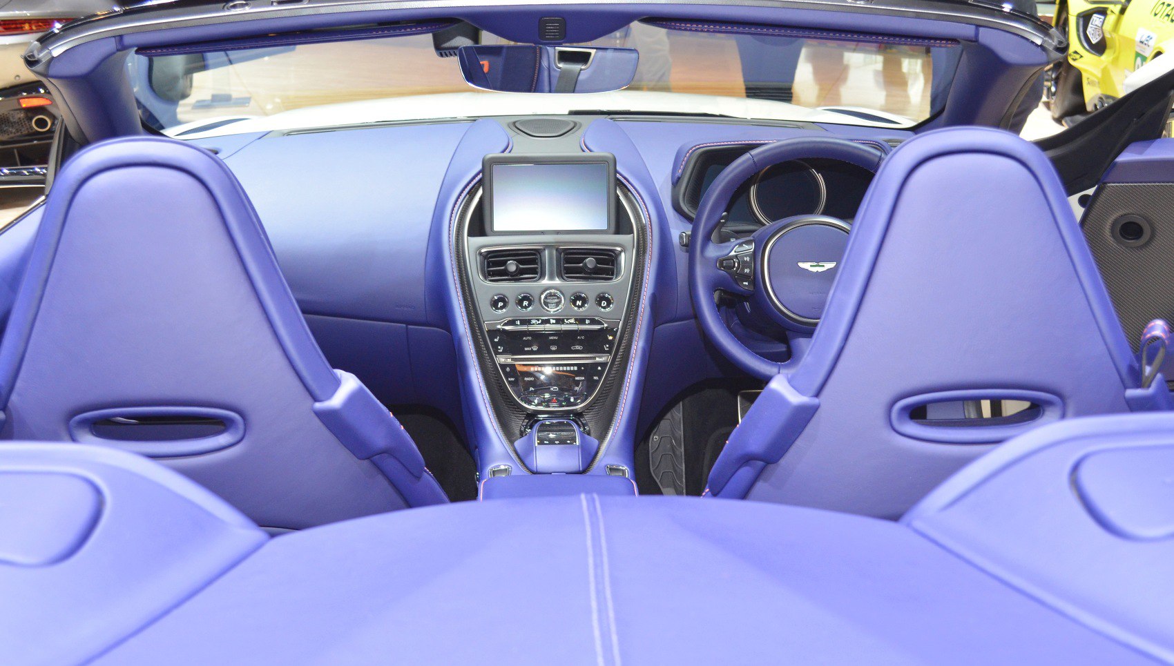 Luxurious blue interior with modern dashboard and convertible cockpit
