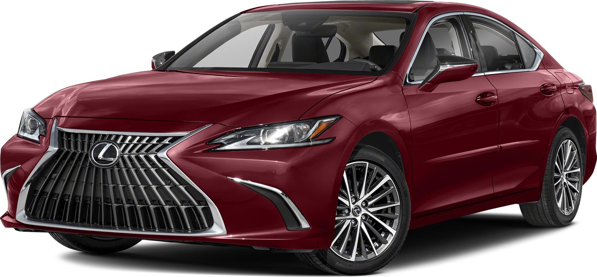 Close-up of front spindle grille and headlight of a maroon luxury sedan