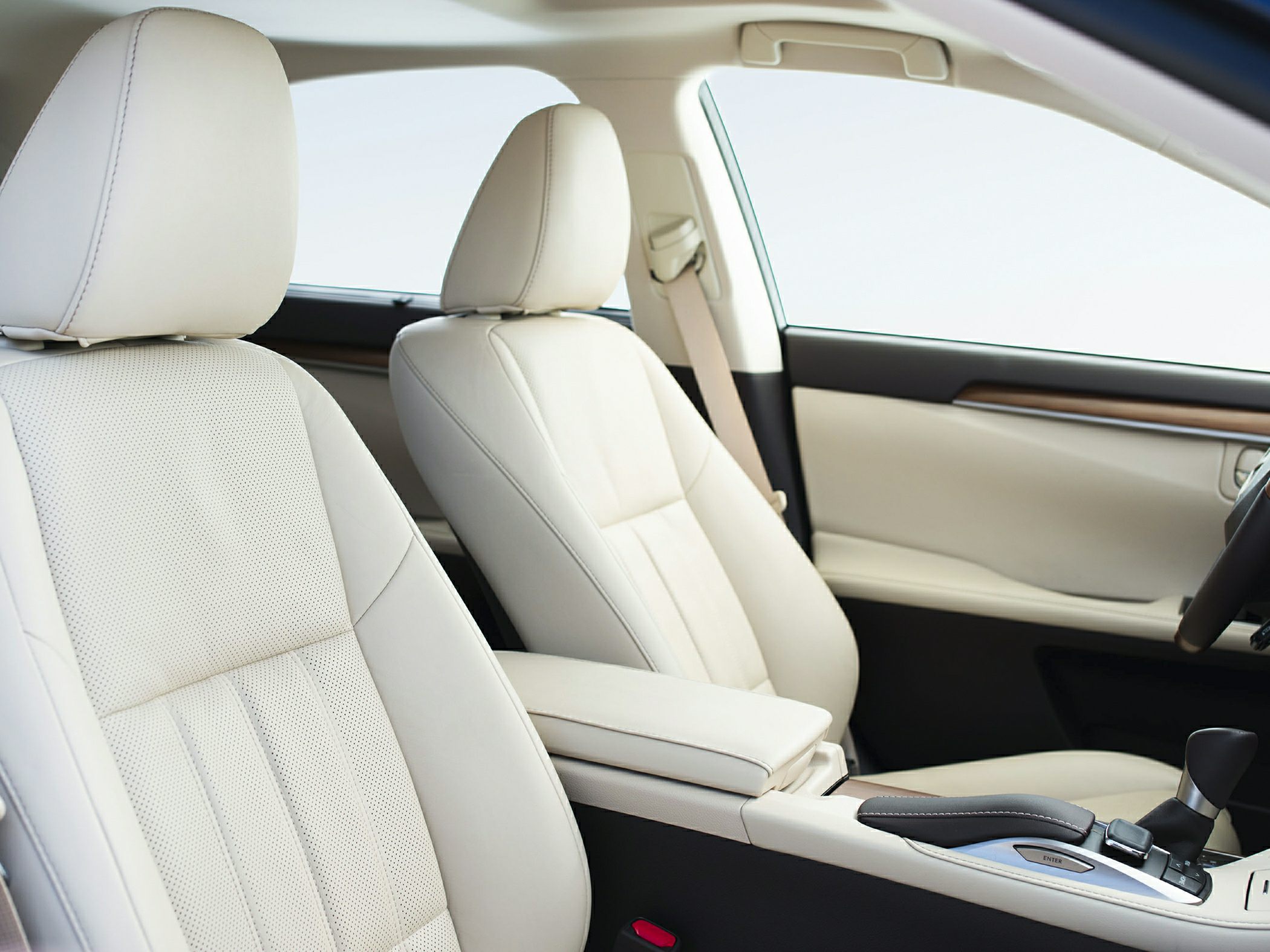 Beige leather front seats and center console with gear shifter