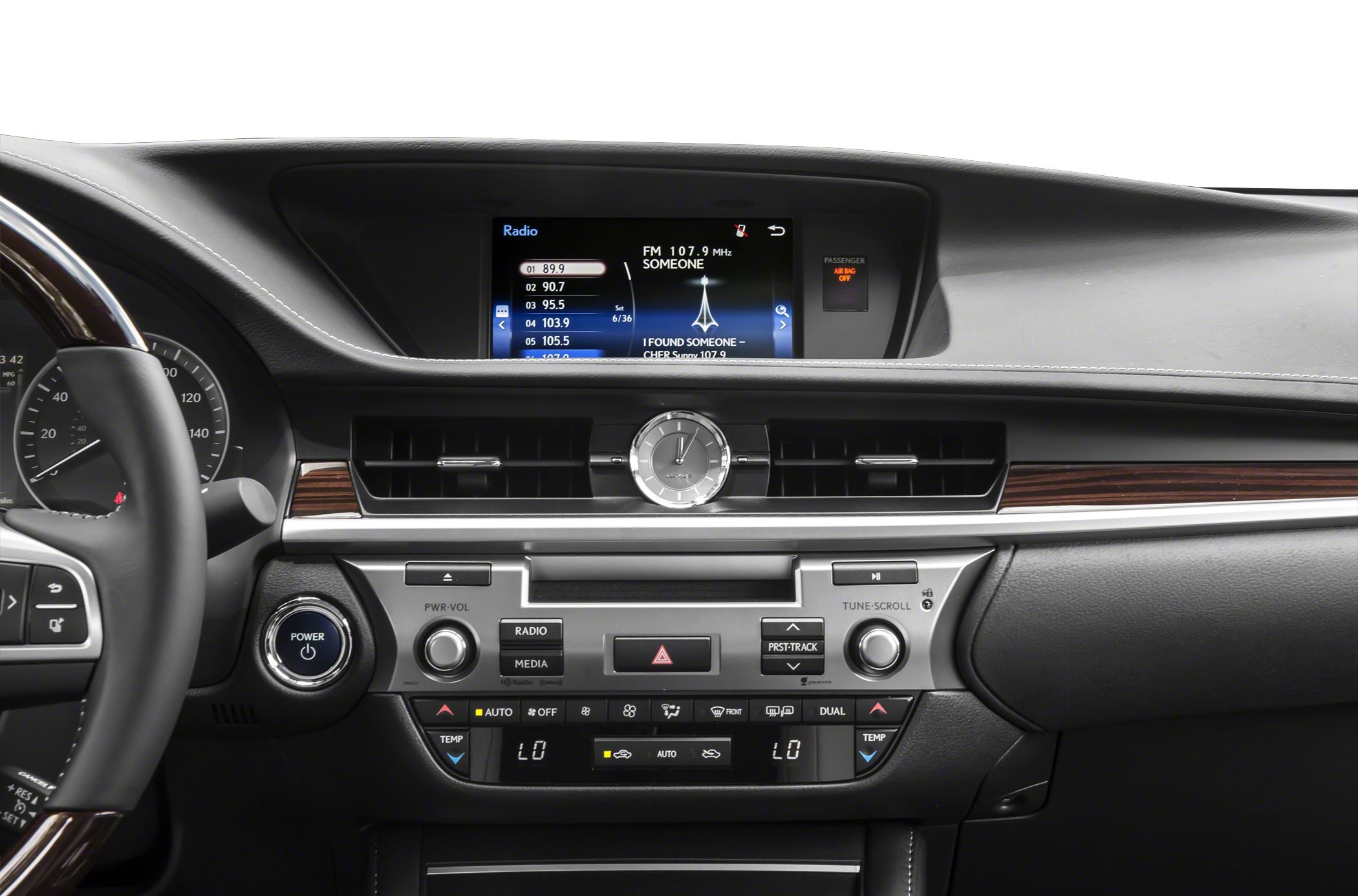 Dashboard with analog clock and infotainment screen