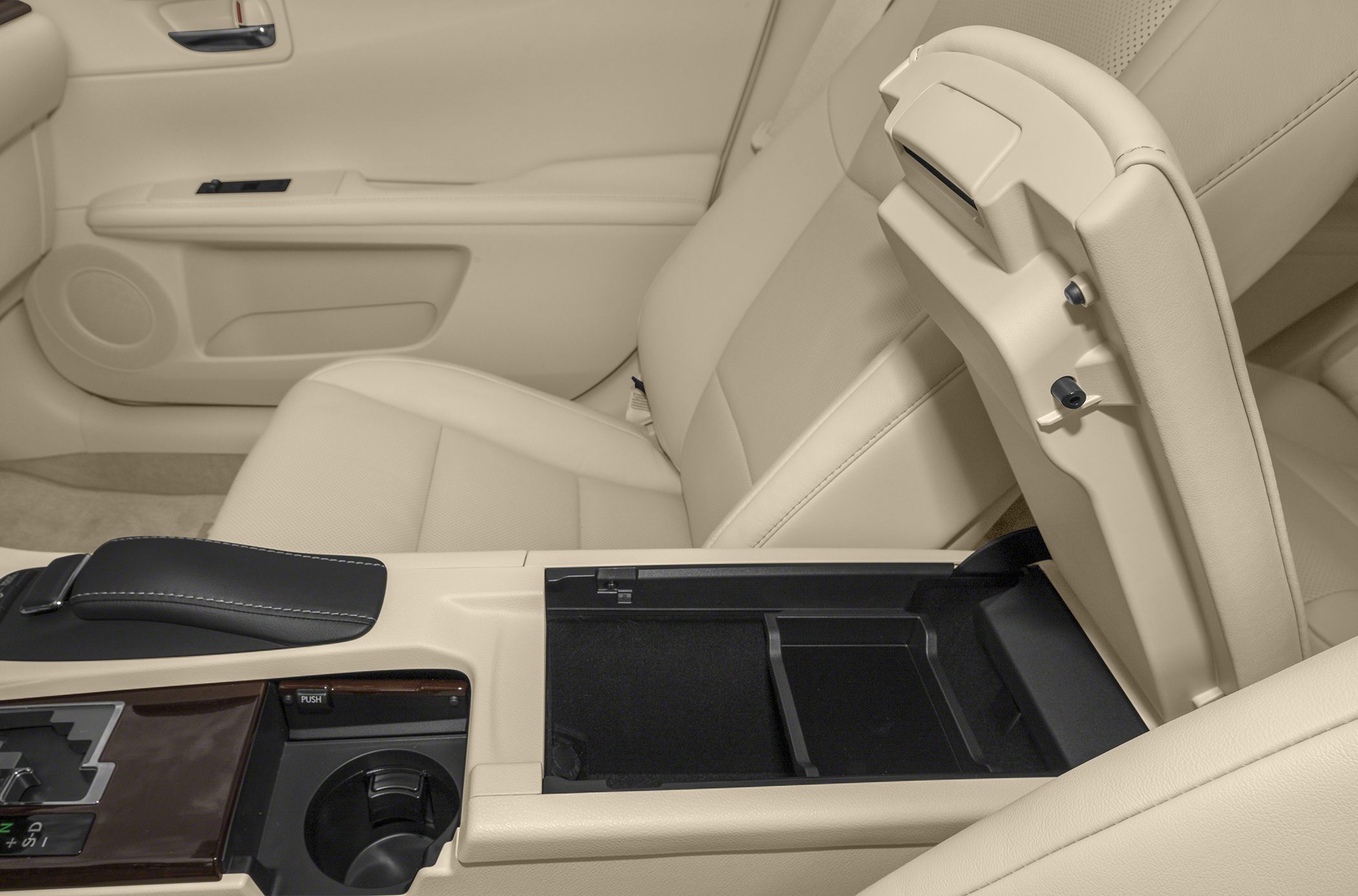Beige leather seats and center console storage with cup holder