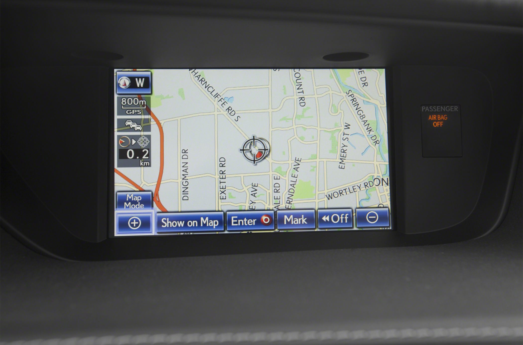 Car dashboard GPS navigation screen and passenger airbag indicator