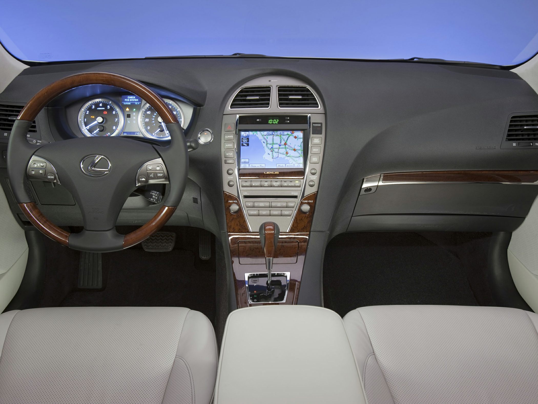 Wood-trimmed steering wheel and dashboard with center console navigation