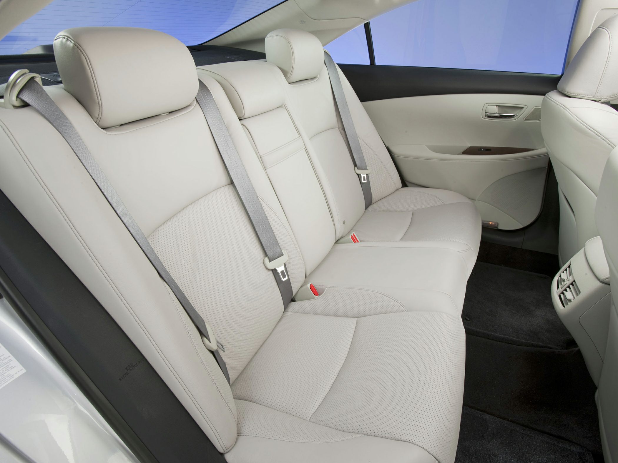 Leather rear seat with seat belts and headrests.