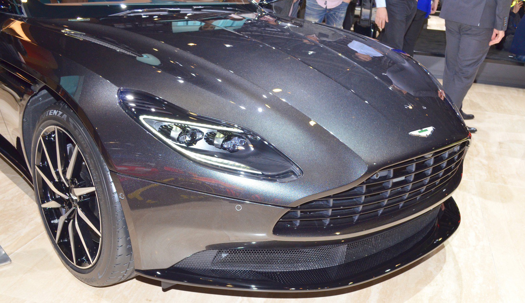 Close-up of LED headlights, alloy wheel, and front grille.