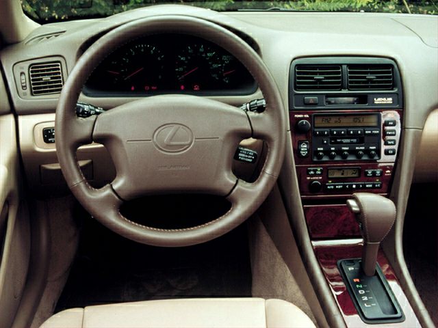Dashboard, steering wheel, and center console with wood trim