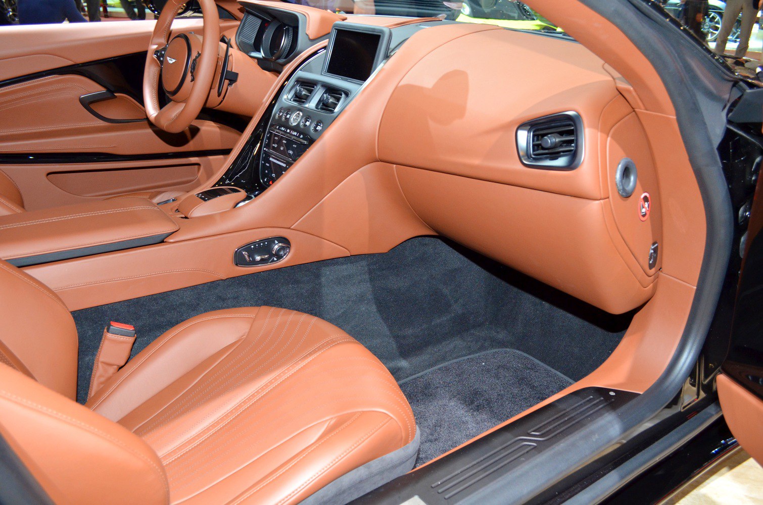 Luxury car interior with brown leather and modern dashboard features