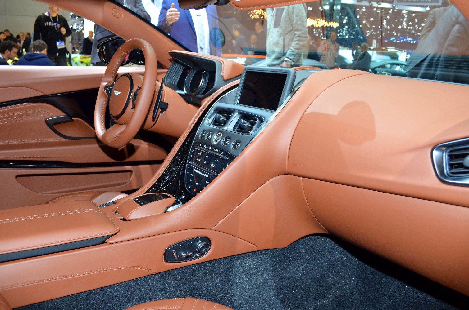 Brown leather interior with dashboard center console and seat controls