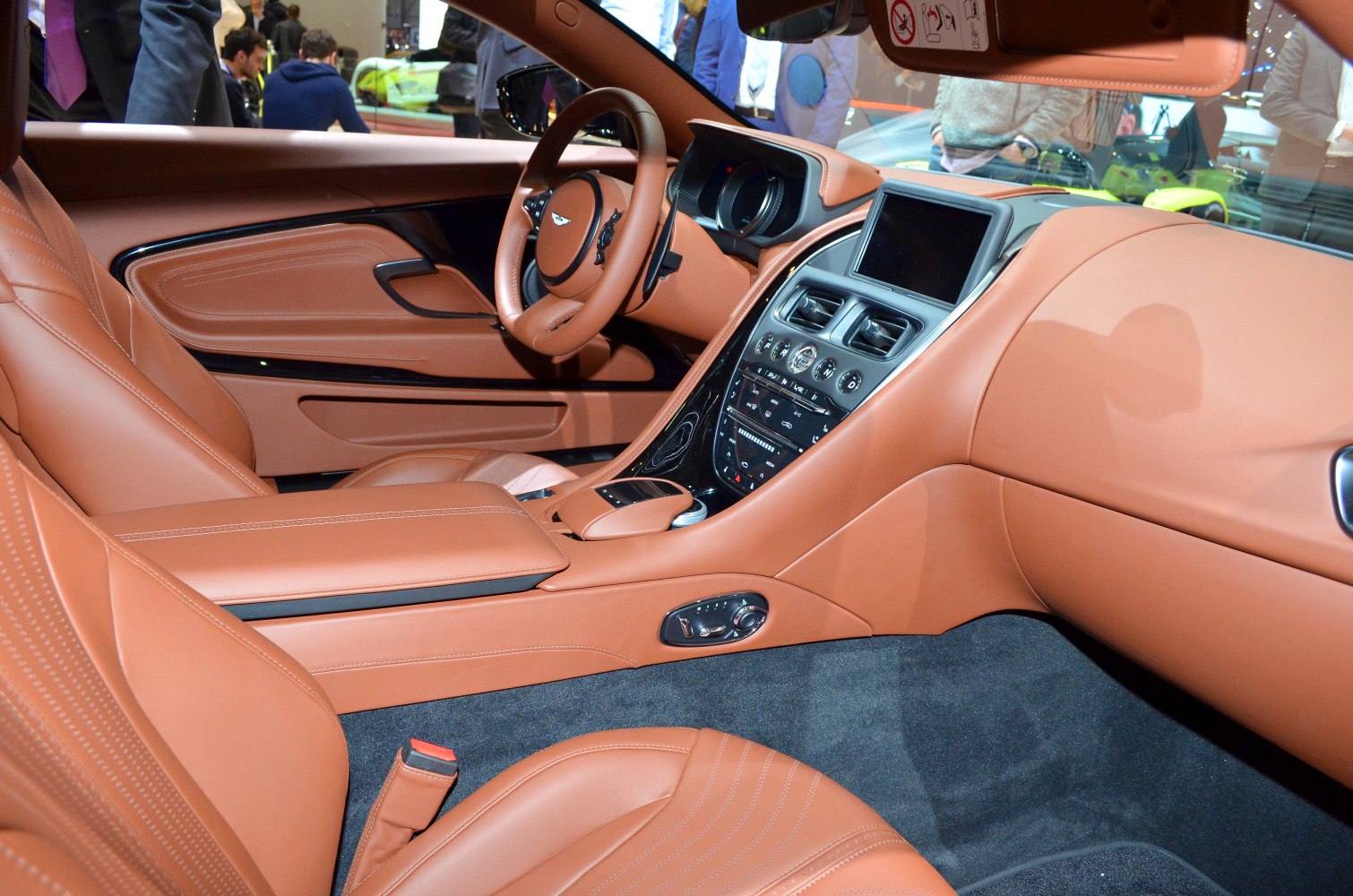 Luxury brown leather seats and sleek dashboard with touchscreen and multifunction steering wheel