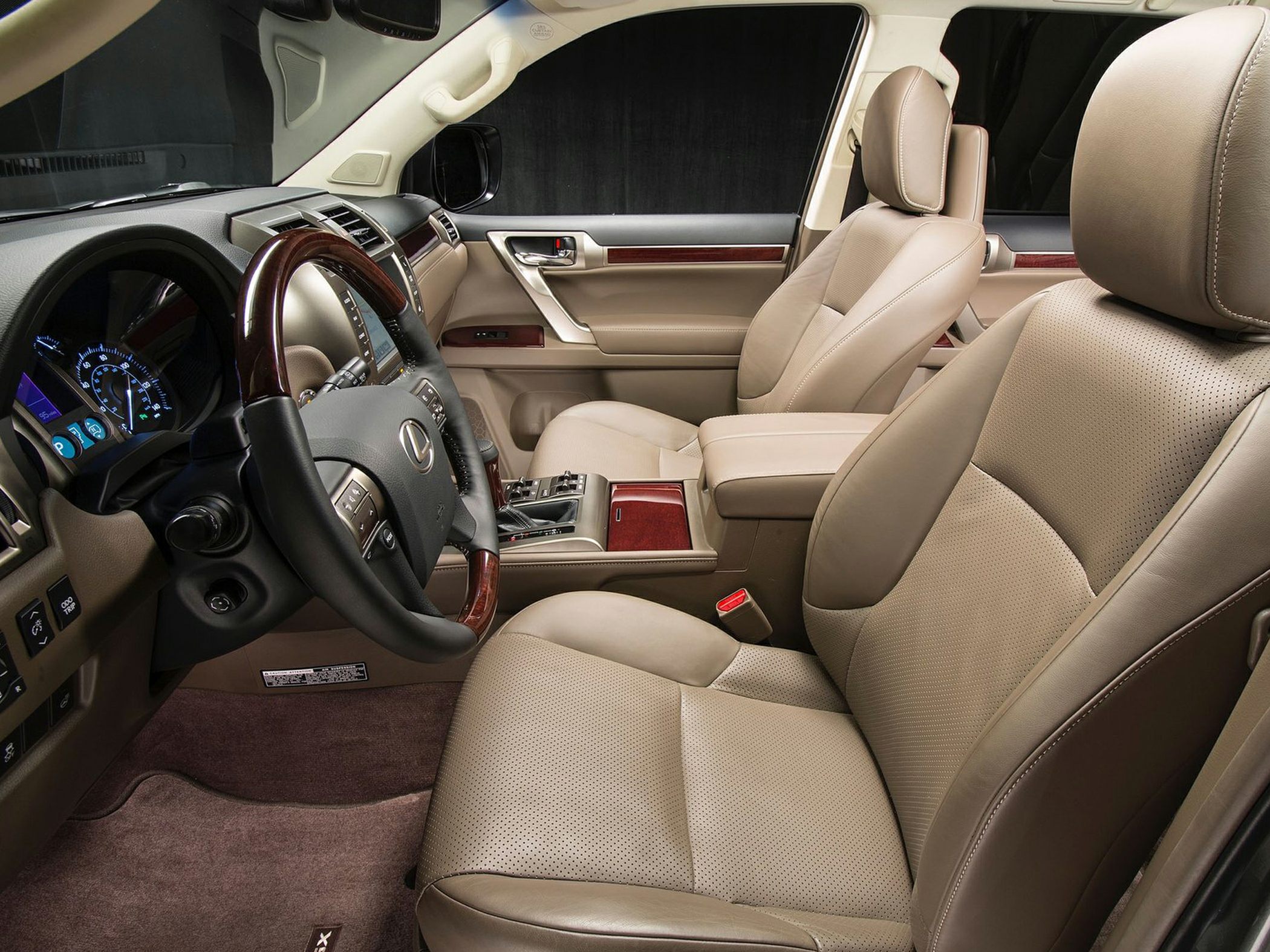 Beige leather seats and wood-trimmed dashboard interior