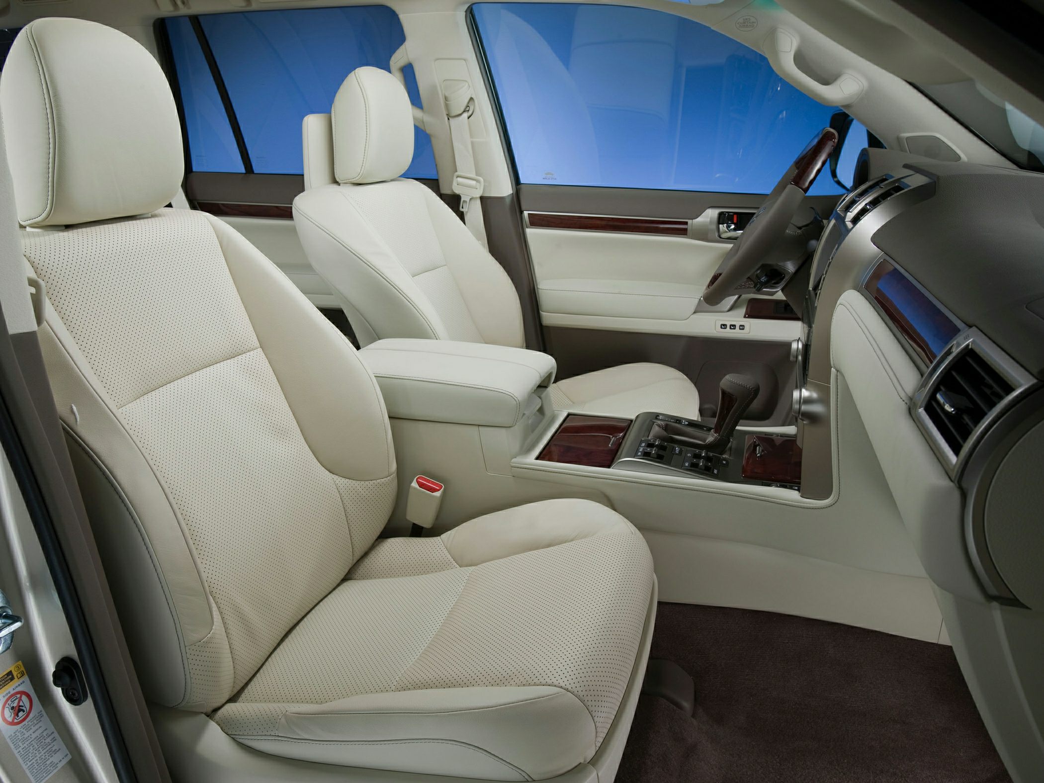 Beige perforated leather seats with wooden interior trim