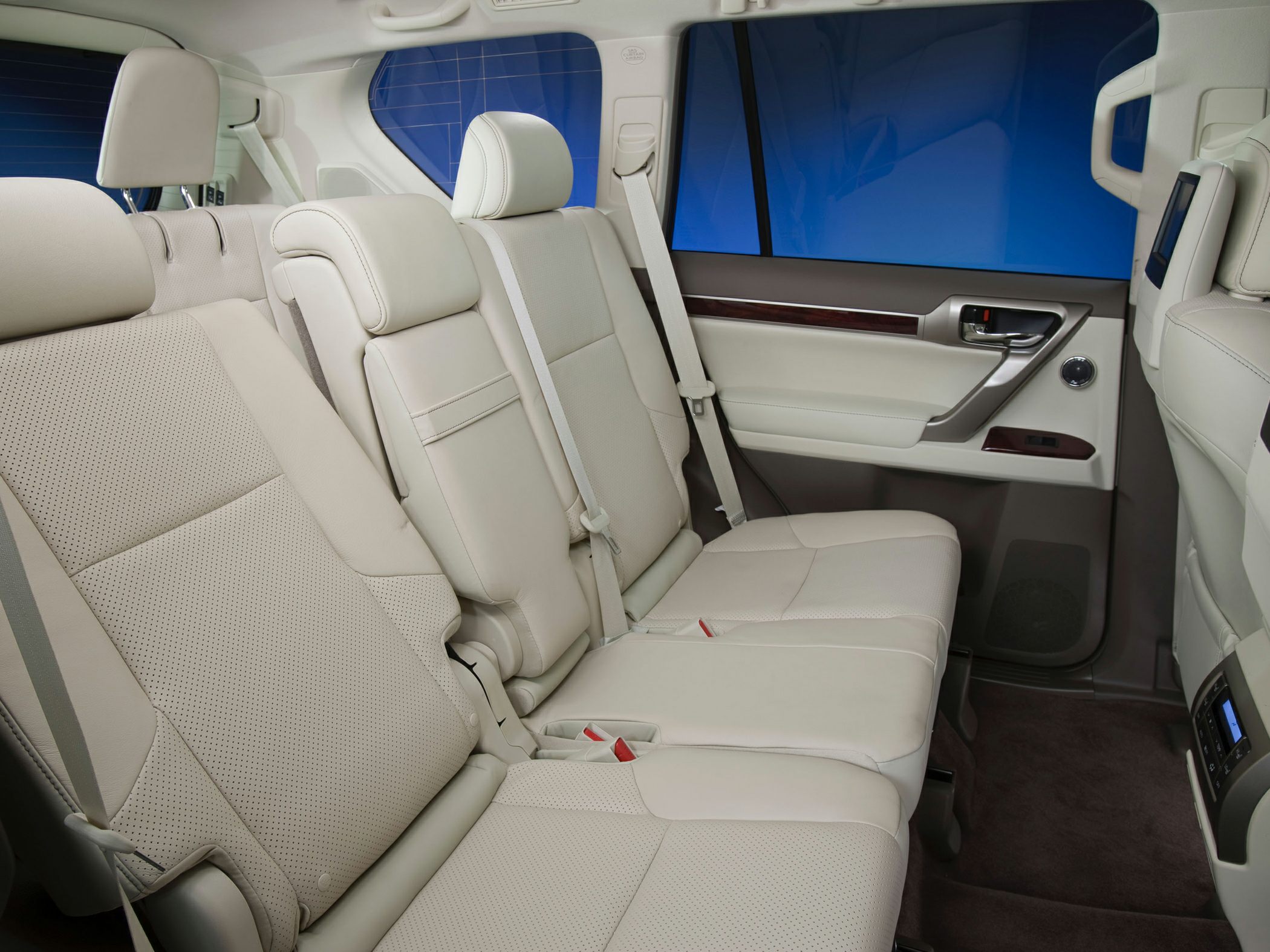 Beige leather rear passenger seats with spacious and luxurious design