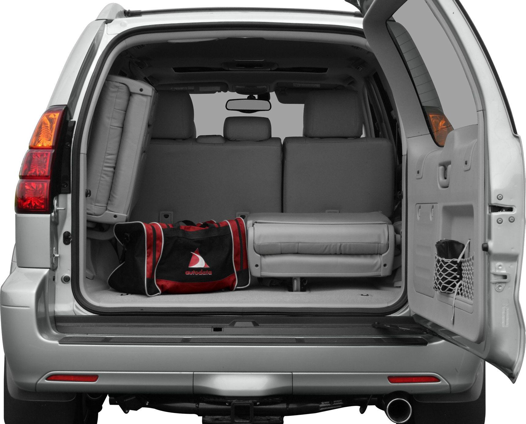 Rear cargo space with foldable third-row seats and storage compartments.