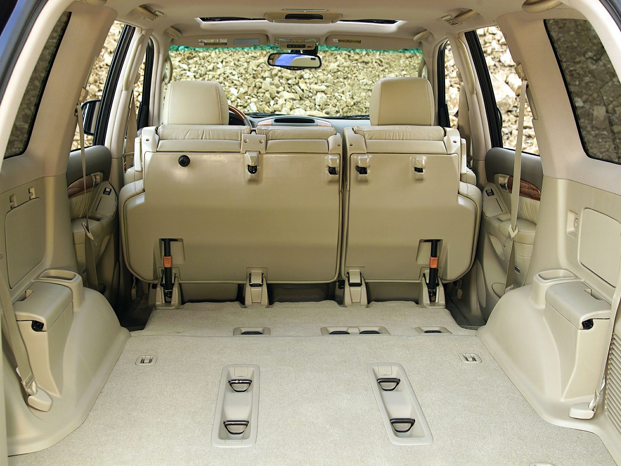 Spacious rear interior with foldable third-row seats and flat cargo floor.
