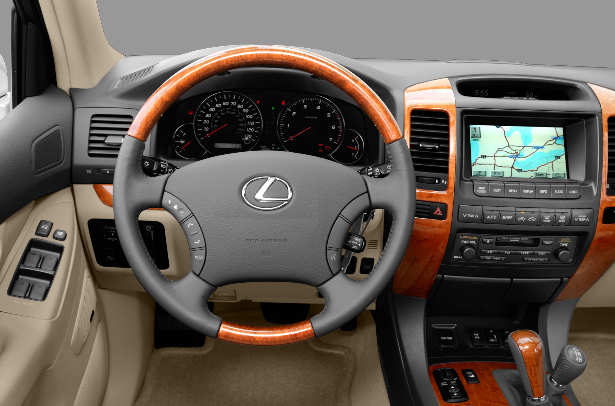 Wood-trimmed steering wheel and dashboard with navigation screen