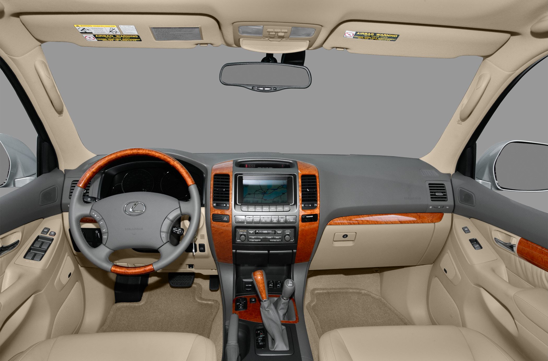 Beige interior with wood-trimmed dashboard and navigation display