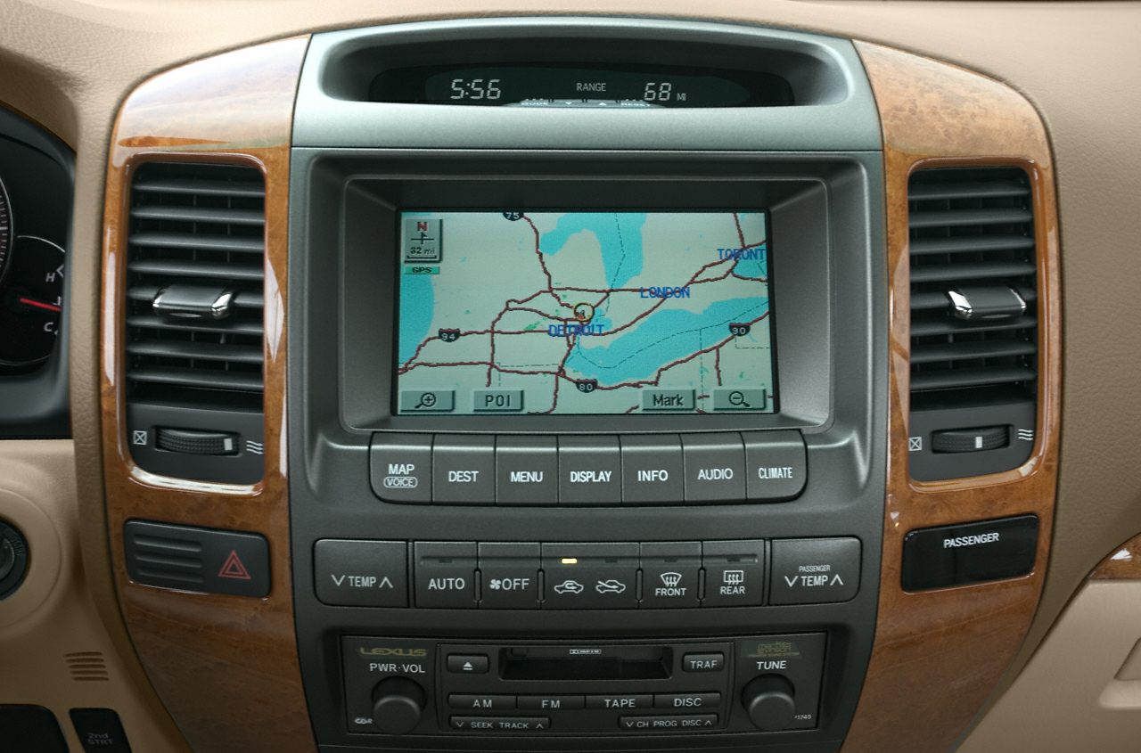 In-dash GPS navigation and climate control panel with wood trim