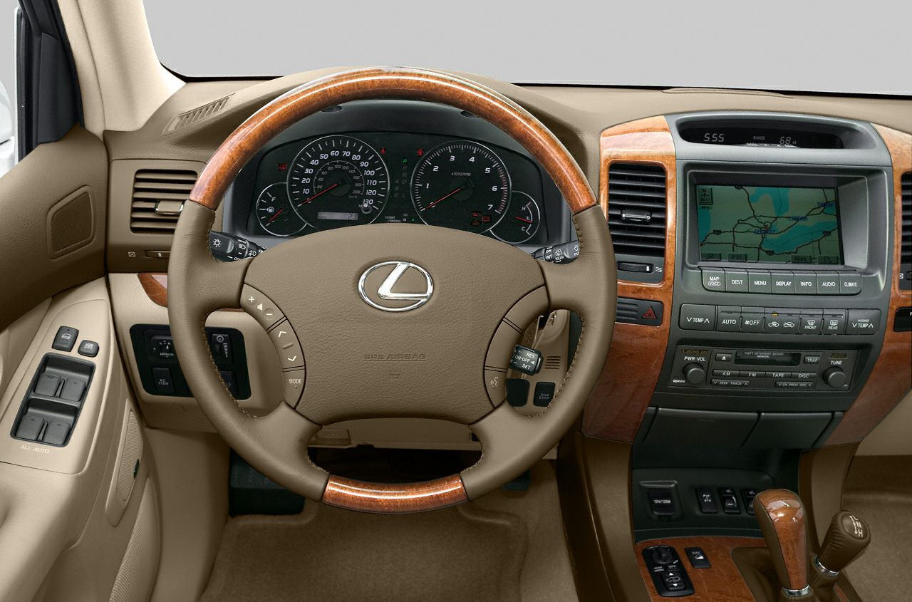 Wood-trimmed steering wheel and digital navigation dashboard